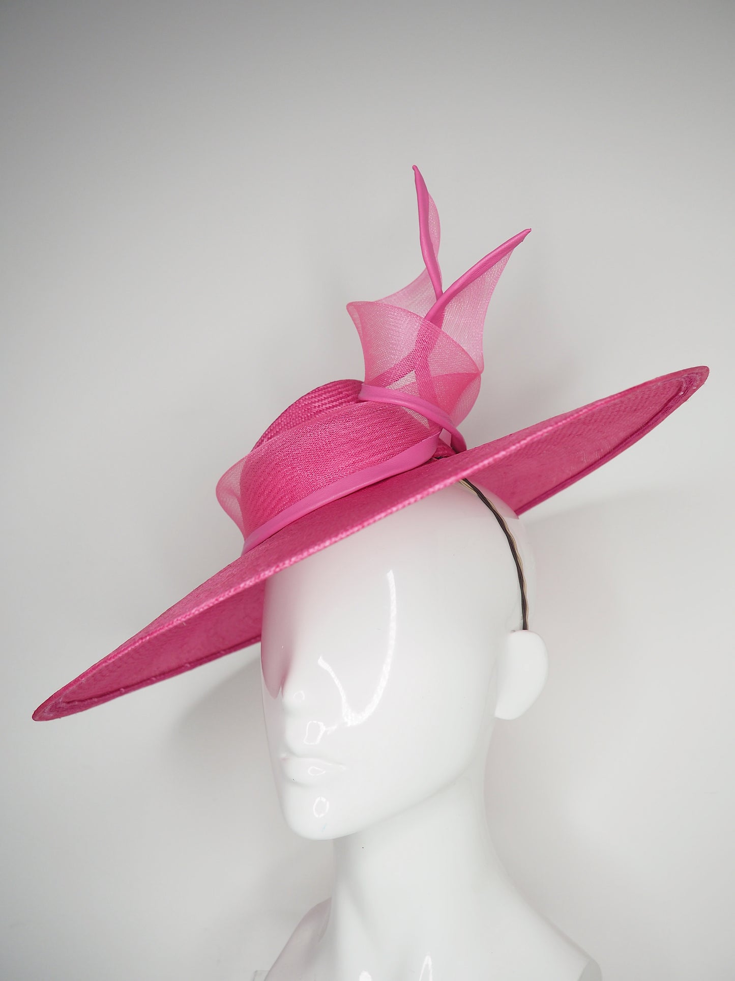 Pink Lady - Pink broad brimmed slanted crown parissisal with crinoline leather edged swirl detail