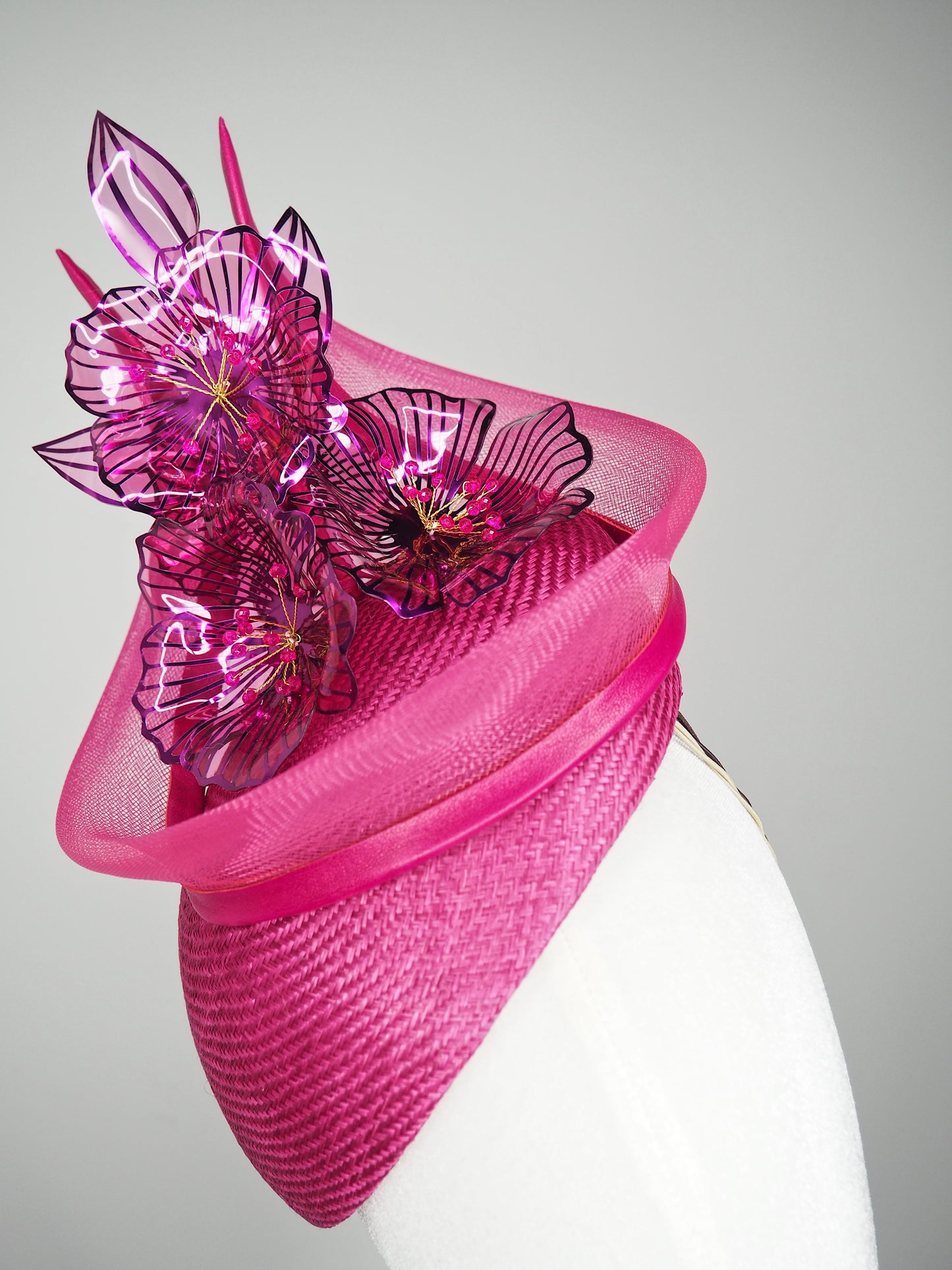 Berry Burst -Magenta hand-dyed straw facehugger base with magenta metallic edged crystoform flowers and magenta crinoline swirl