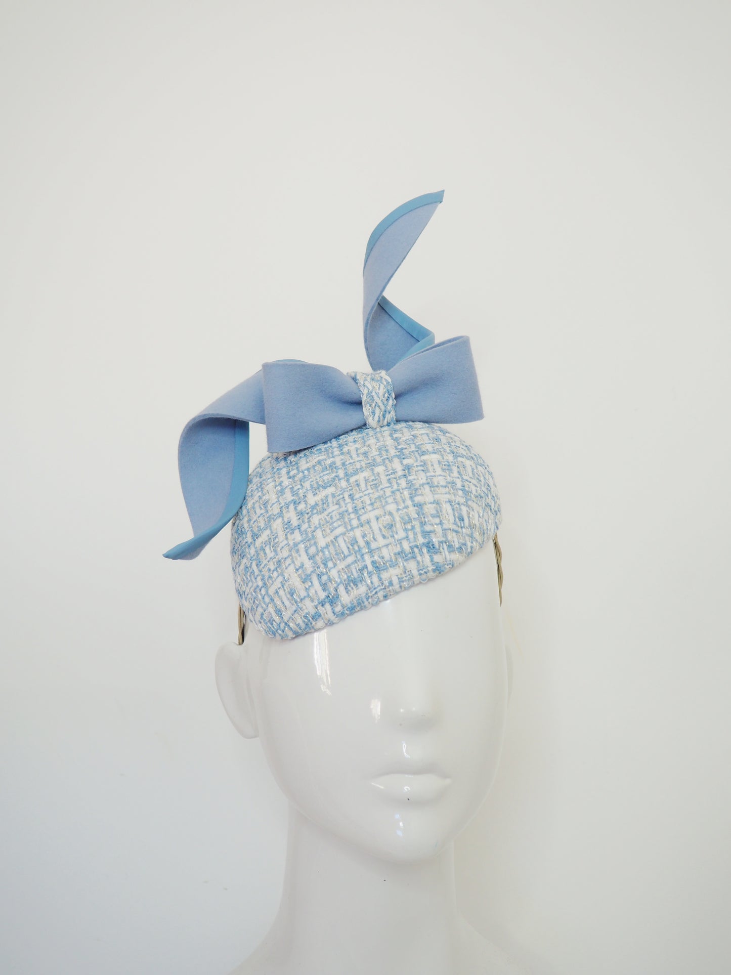 Blue swirl and whirl - Powder blue leather edged wired felt bow on a tweed petite facehugger