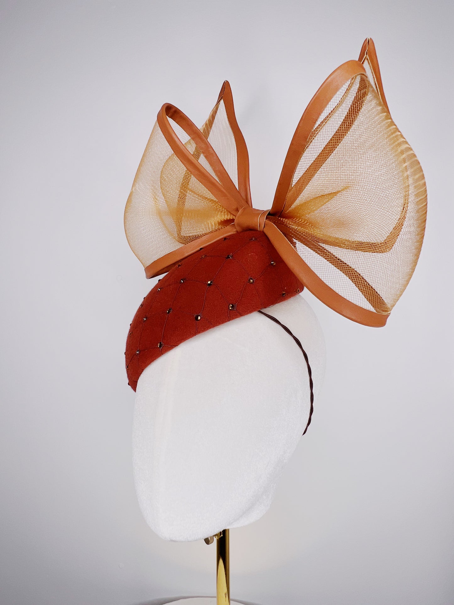 Coco Delight - Brown fur felt face hugger with dramatic crinoline bow and crystal veil detail.