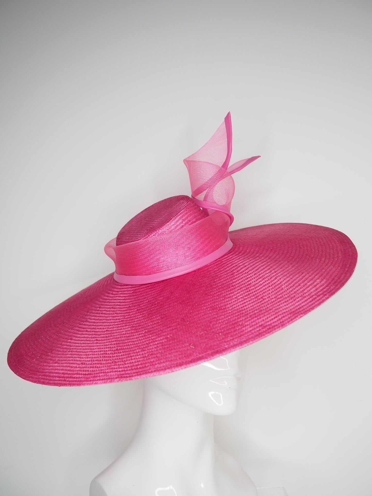 Pink Lady - Pink broad brimmed slanted crown parissisal with crinoline leather edged swirl detail