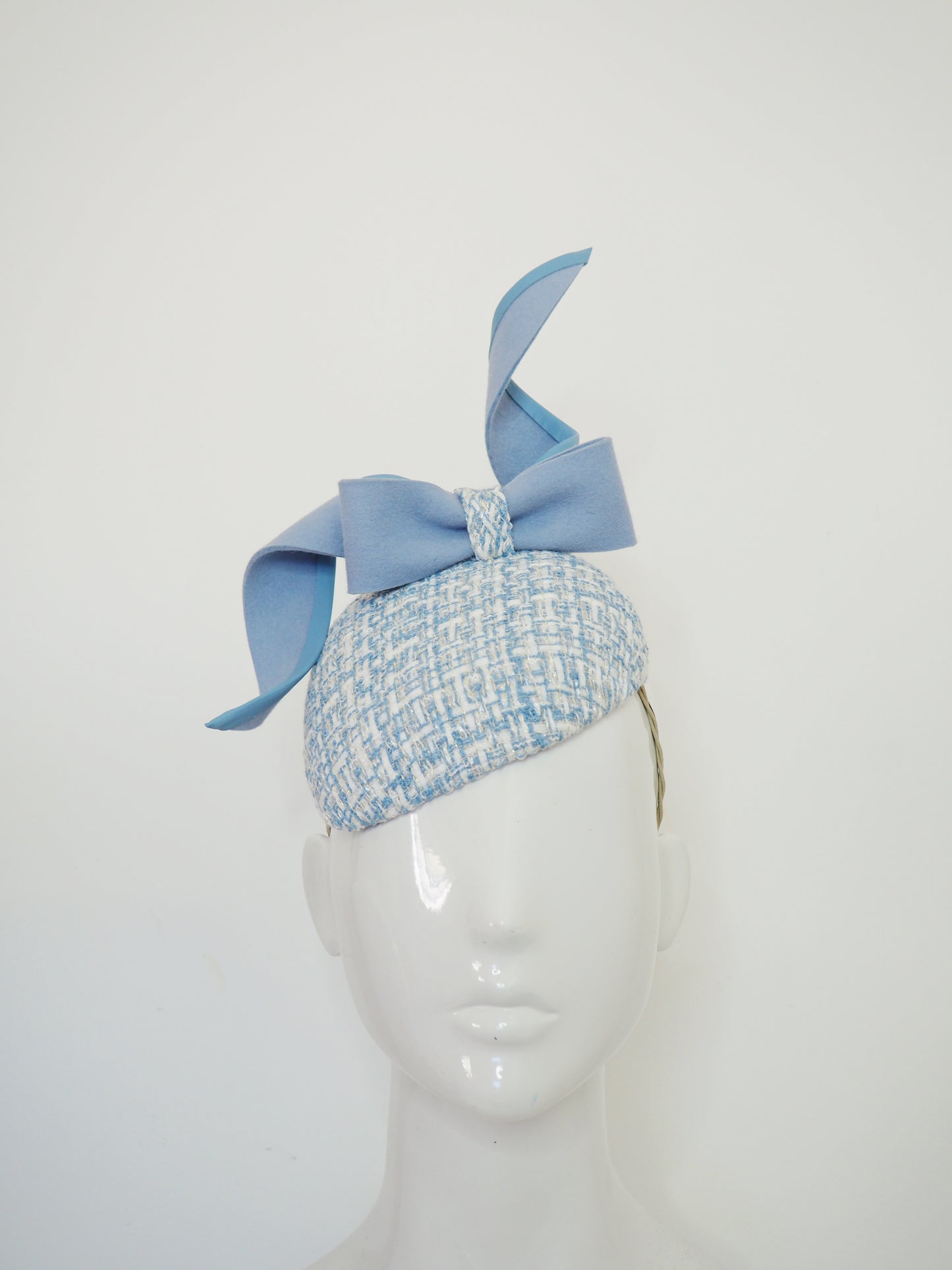 Blue swirl and whirl - Powder blue leather edged wired felt bow on a tweed petite facehugger