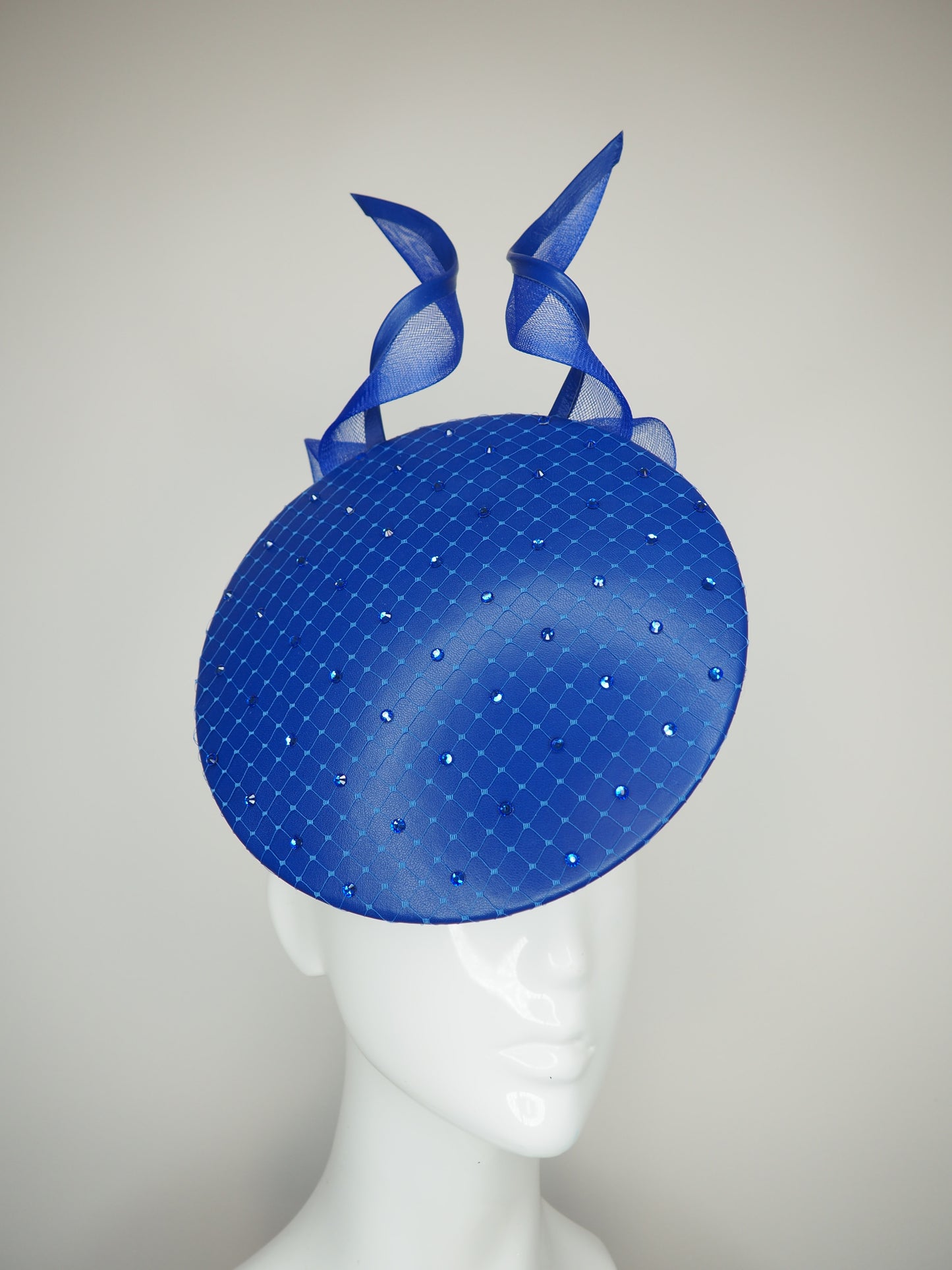 Sapphire Shimmer - Blue floating disc with leather bound crinoline bow and crystal embellsihed veil
