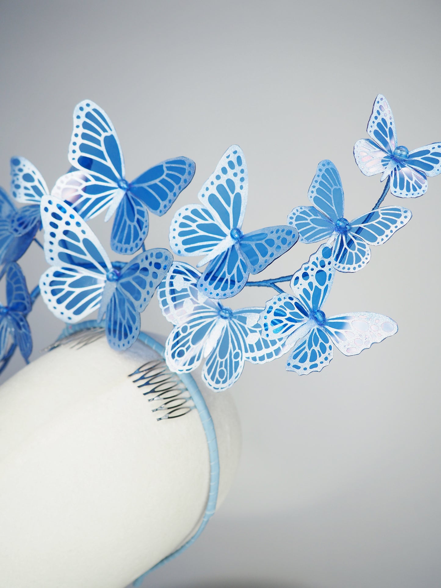 Dancing Wings - A graceful cascade of blue butterflies that appear to float effortlessly around the face.