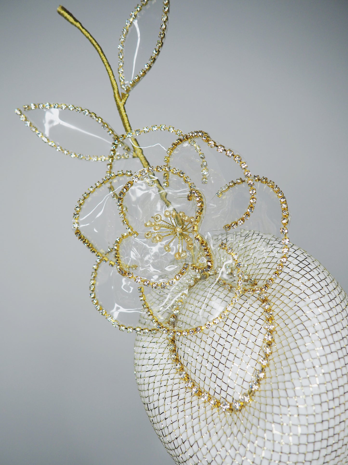 Golden Hour Rose - Pale gold lurex pork pie pillbox with gold diamante chain detail and a diamante encrusted crystoform rose