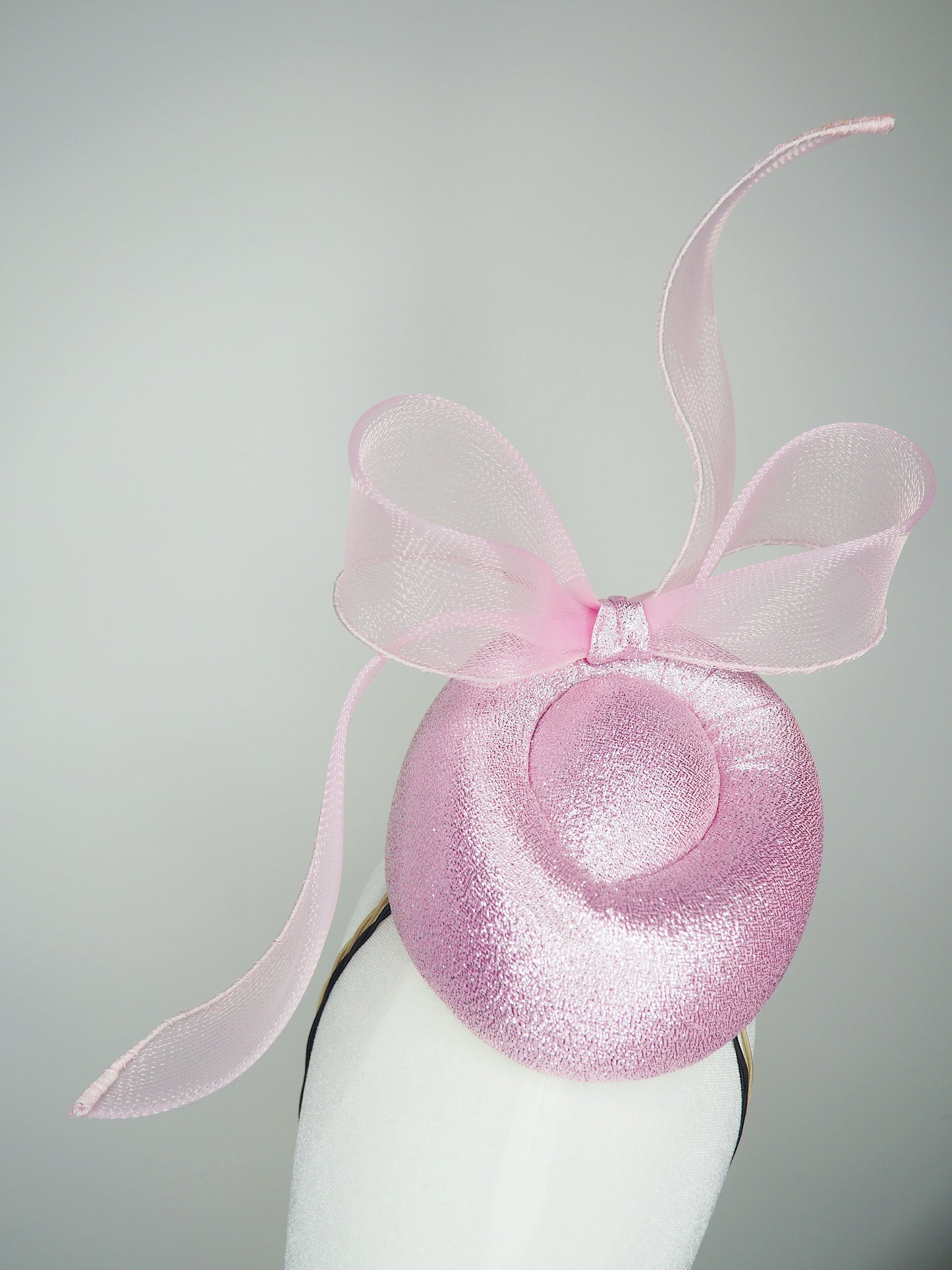 Pastel Polly - Windswept pink metallic fabric pork pie pillbox with a windswept crinoline bow