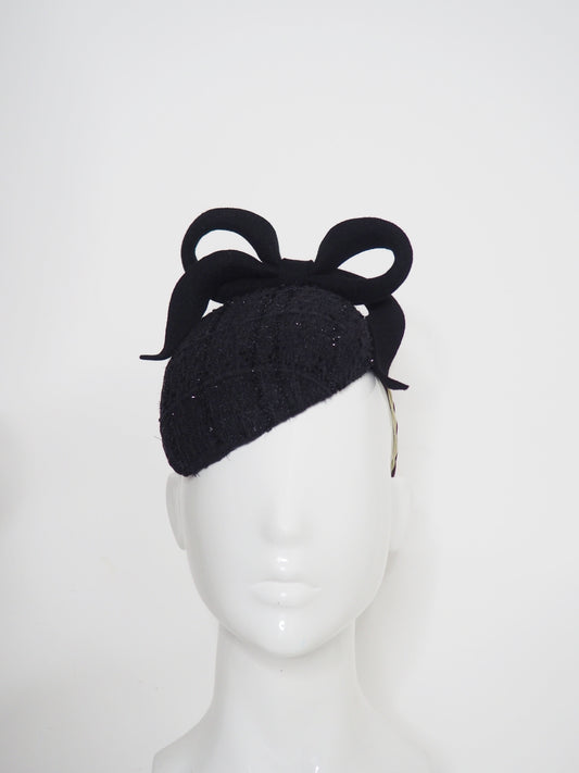 Baby Bow - Black fur felt sculpted bow on a tweed petite facehugger base.