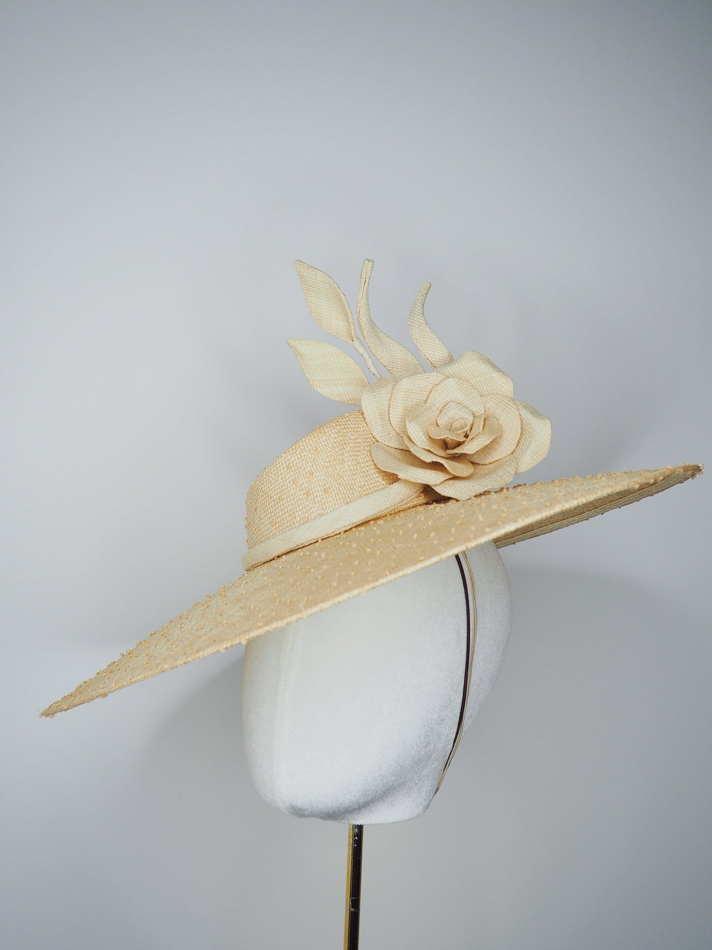 Nature in Bloom-Natural straw asymmetric brim hat with hand-sculpted rose and swirls