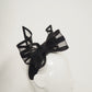 Windswept Bow - Black leather 3d headband with windswept crinoline wired bow.