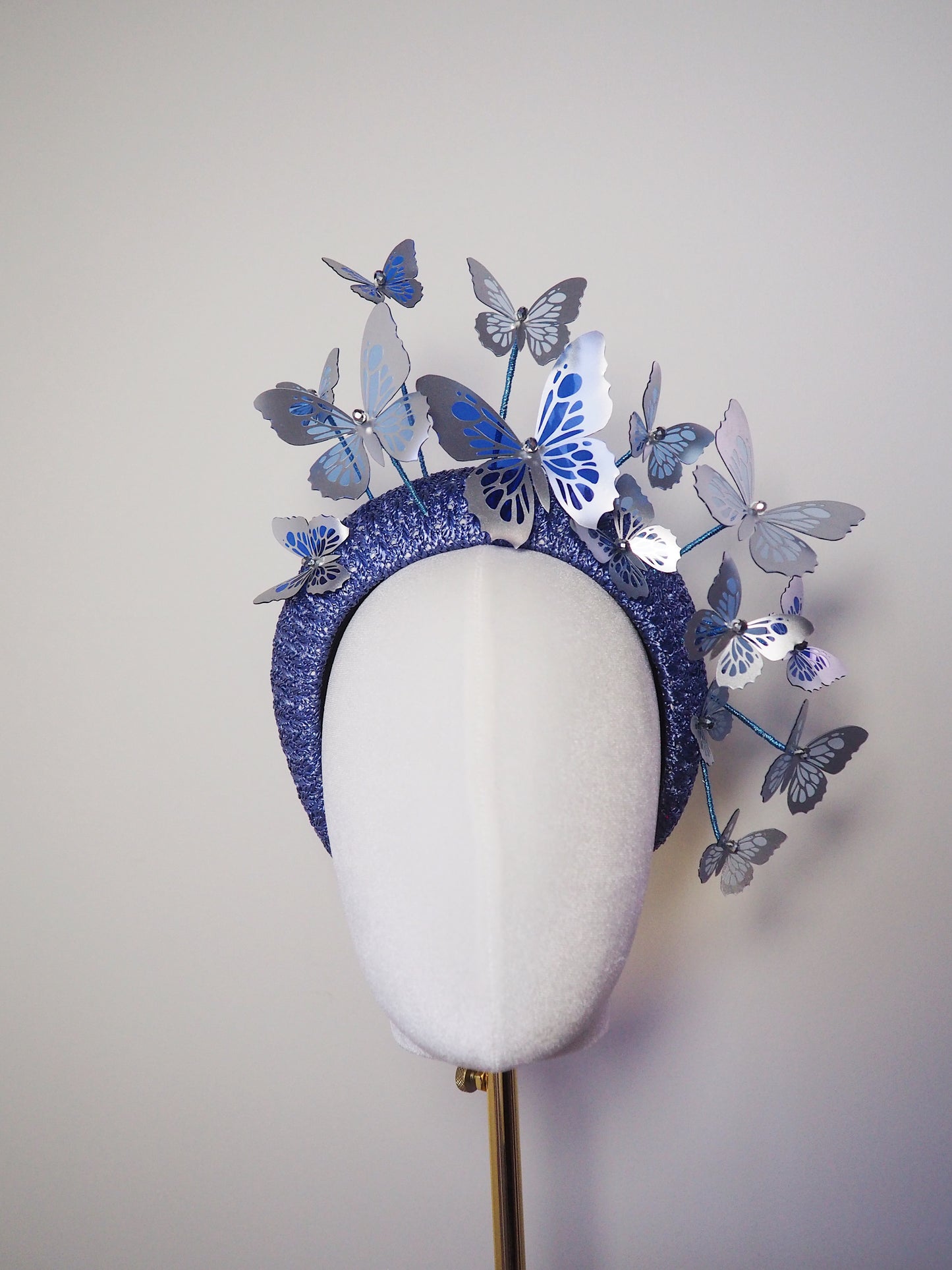 *reduced. Worn once Flutter and fly - Crystoform butterflies in shades of blue with silver detail on a 3d vintage straw headband.