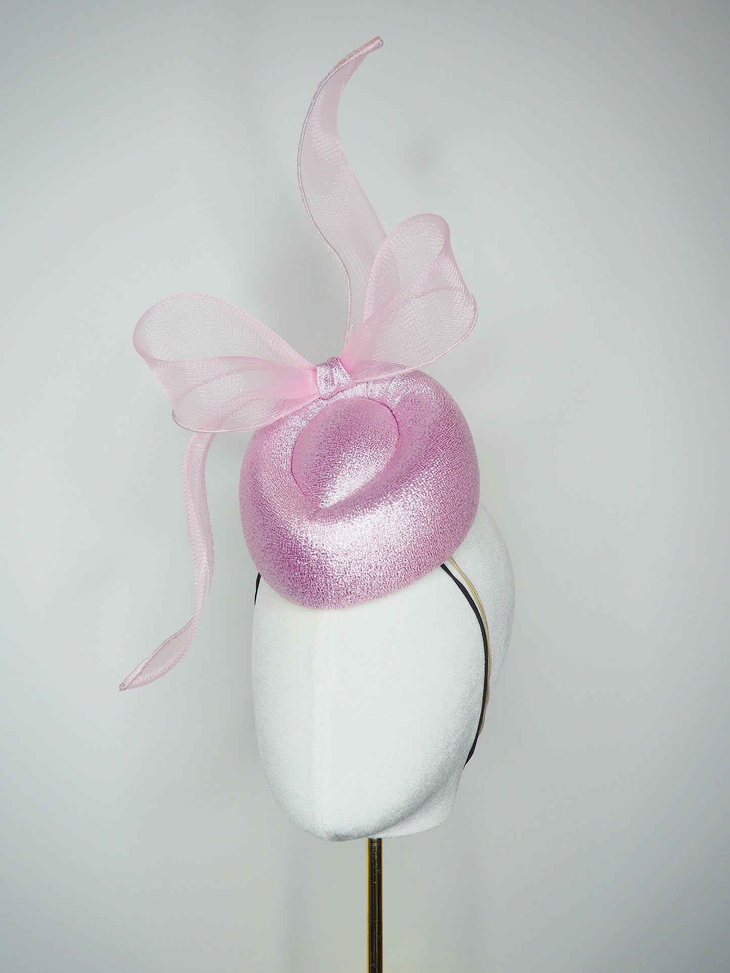 Pastel Polly - Windswept pink metallic fabric pork pie pillbox with a windswept crinoline bow
