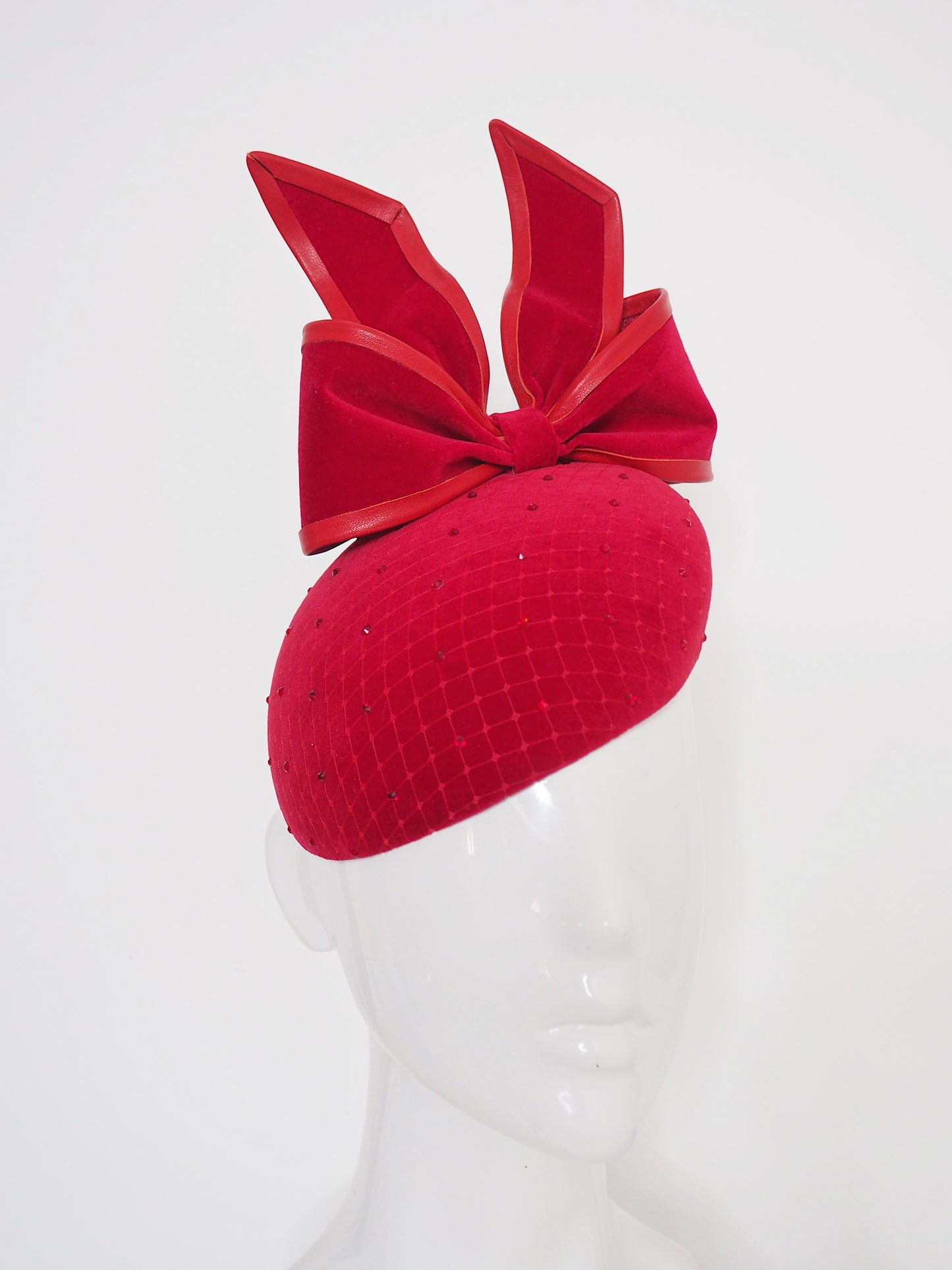 The Gift - Red wired upside down velvet bow with leather and crystal details.