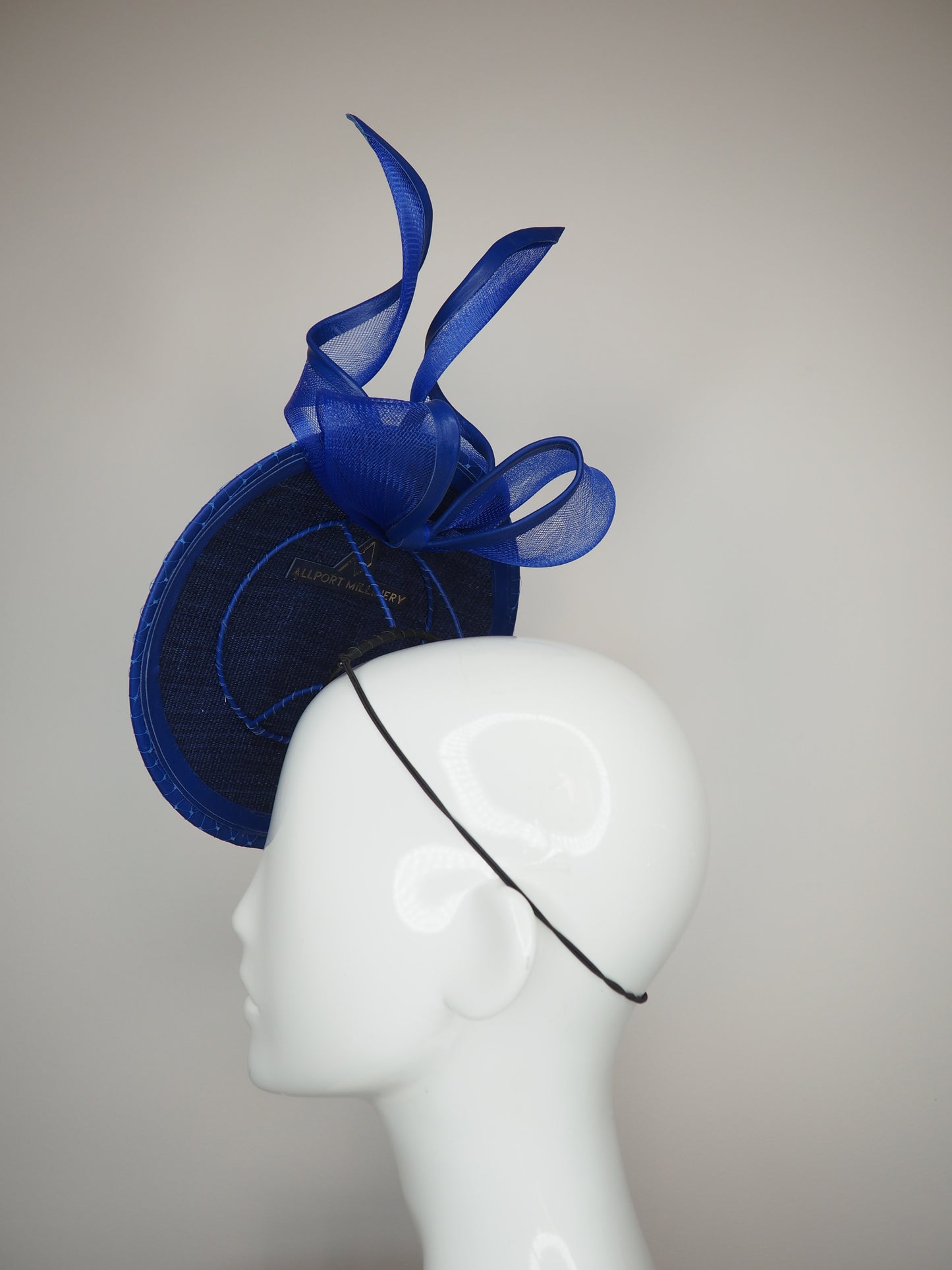 Sapphire Shimmer - Blue floating disc with leather bound crinoline bow and crystal embellsihed veil