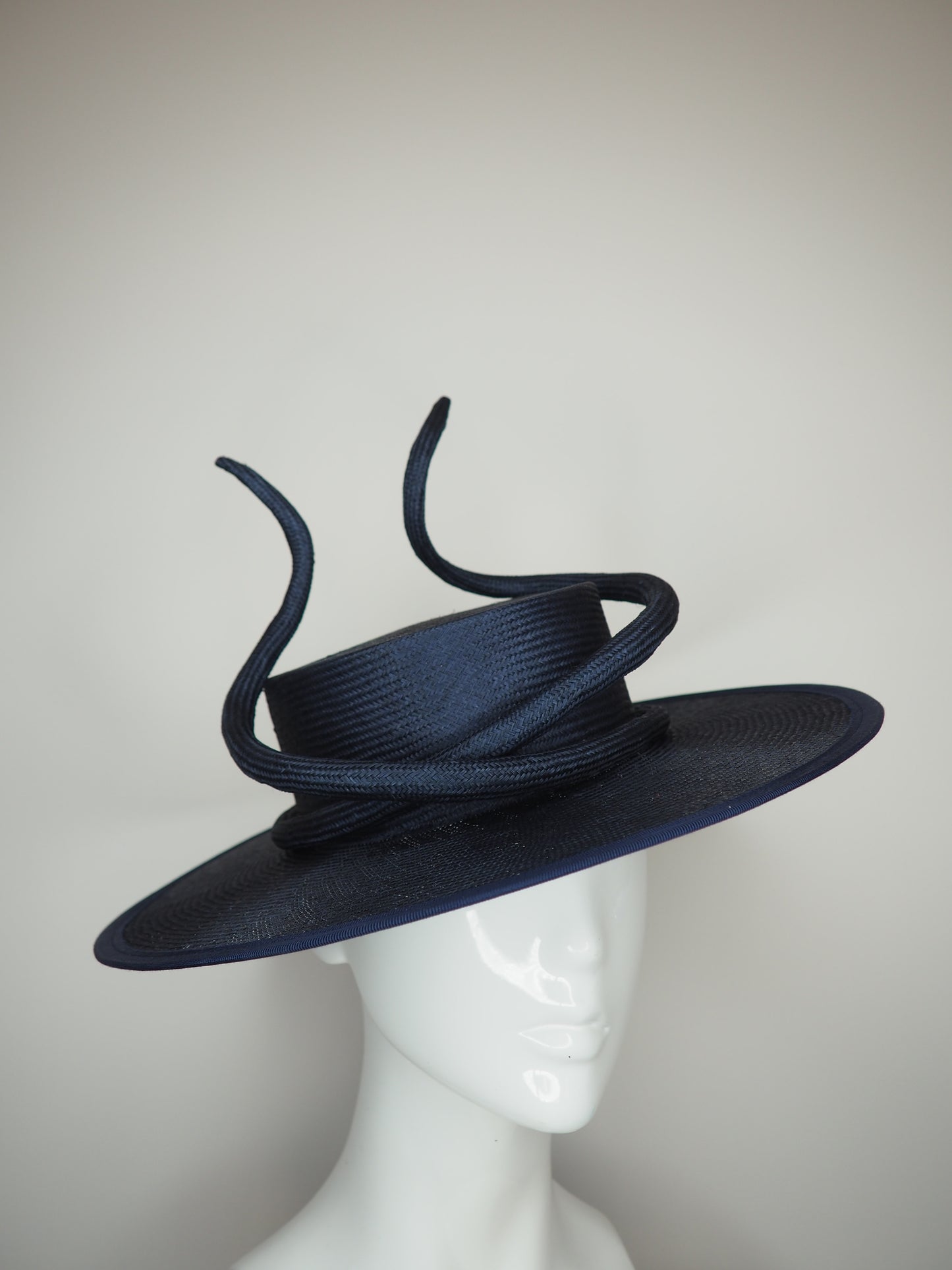 Navy baby - Navy boater with a sculpted parisisal swirl feature