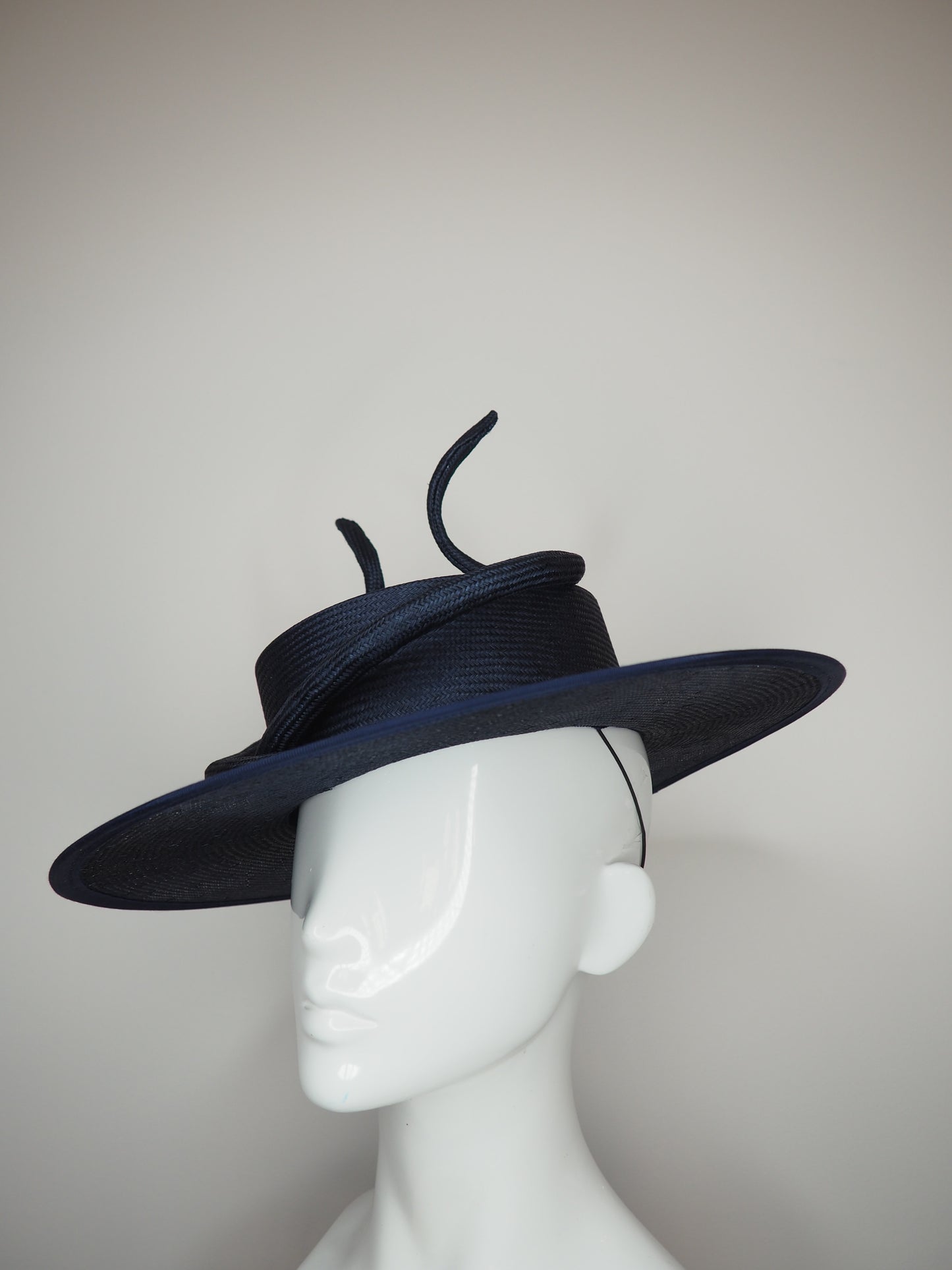 Navy baby - Navy boater with a sculpted parisisal swirl feature