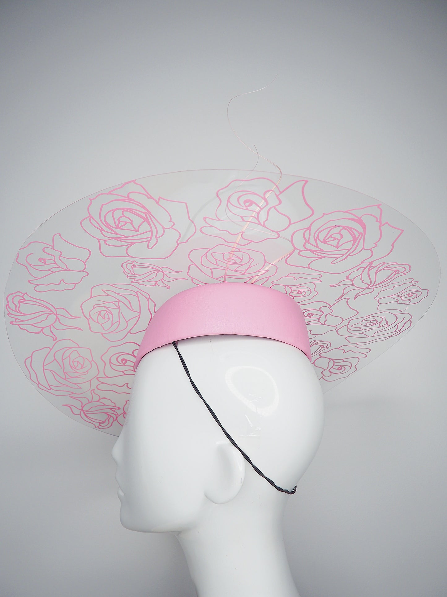 La Vie En Rose - Transparent Crystoform floral patterned brim on a pastel pink leather teardrop base.