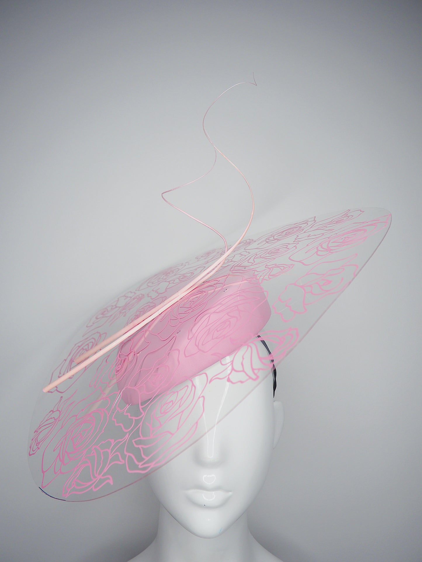 La Vie En Rose - Transparent Crystoform floral patterned brim on a pastel pink leather teardrop base.
