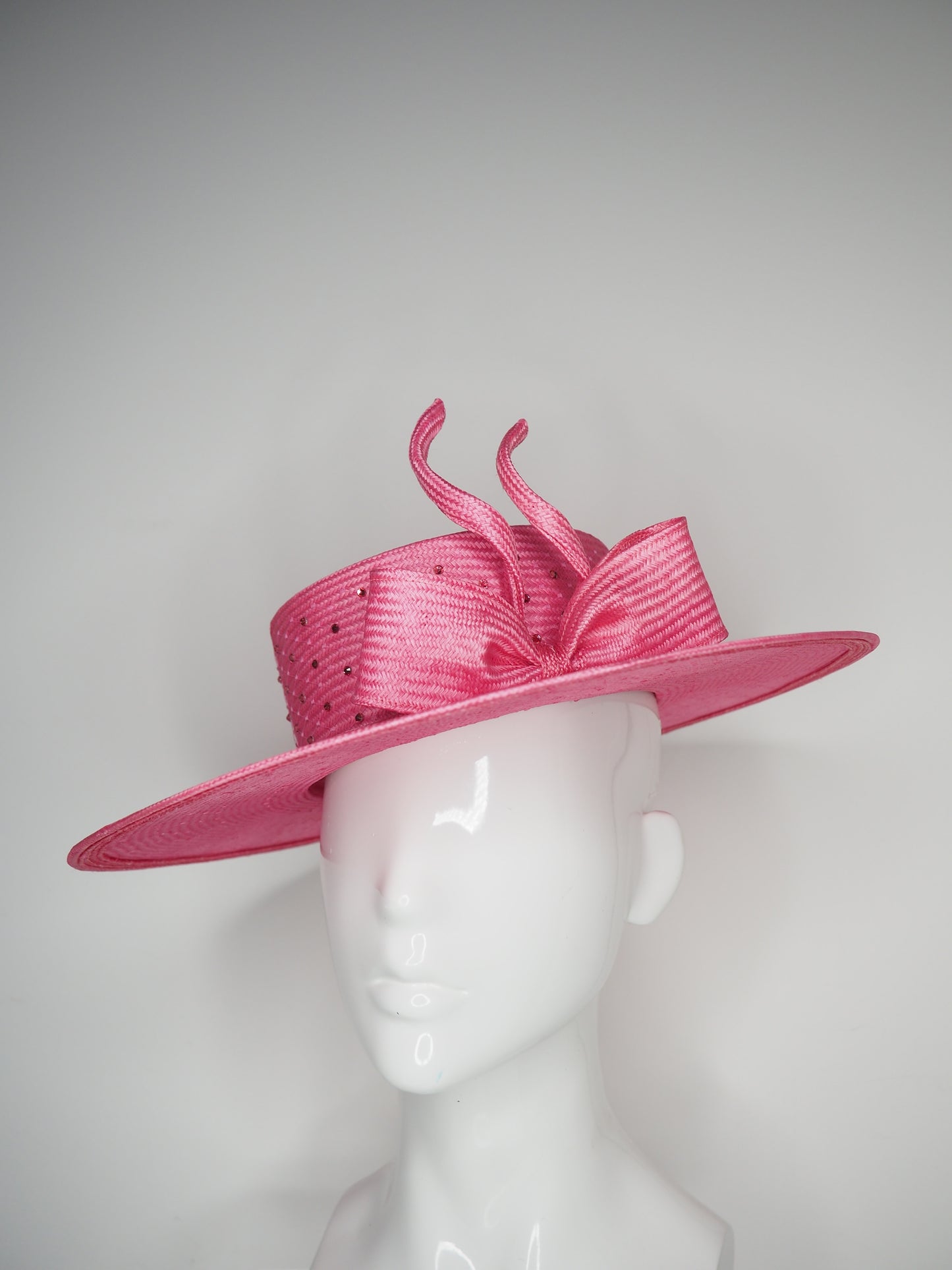 Petal Pink - Pink coloured hand dyed straw boater with sculpted wired bow and diamanté veil detail