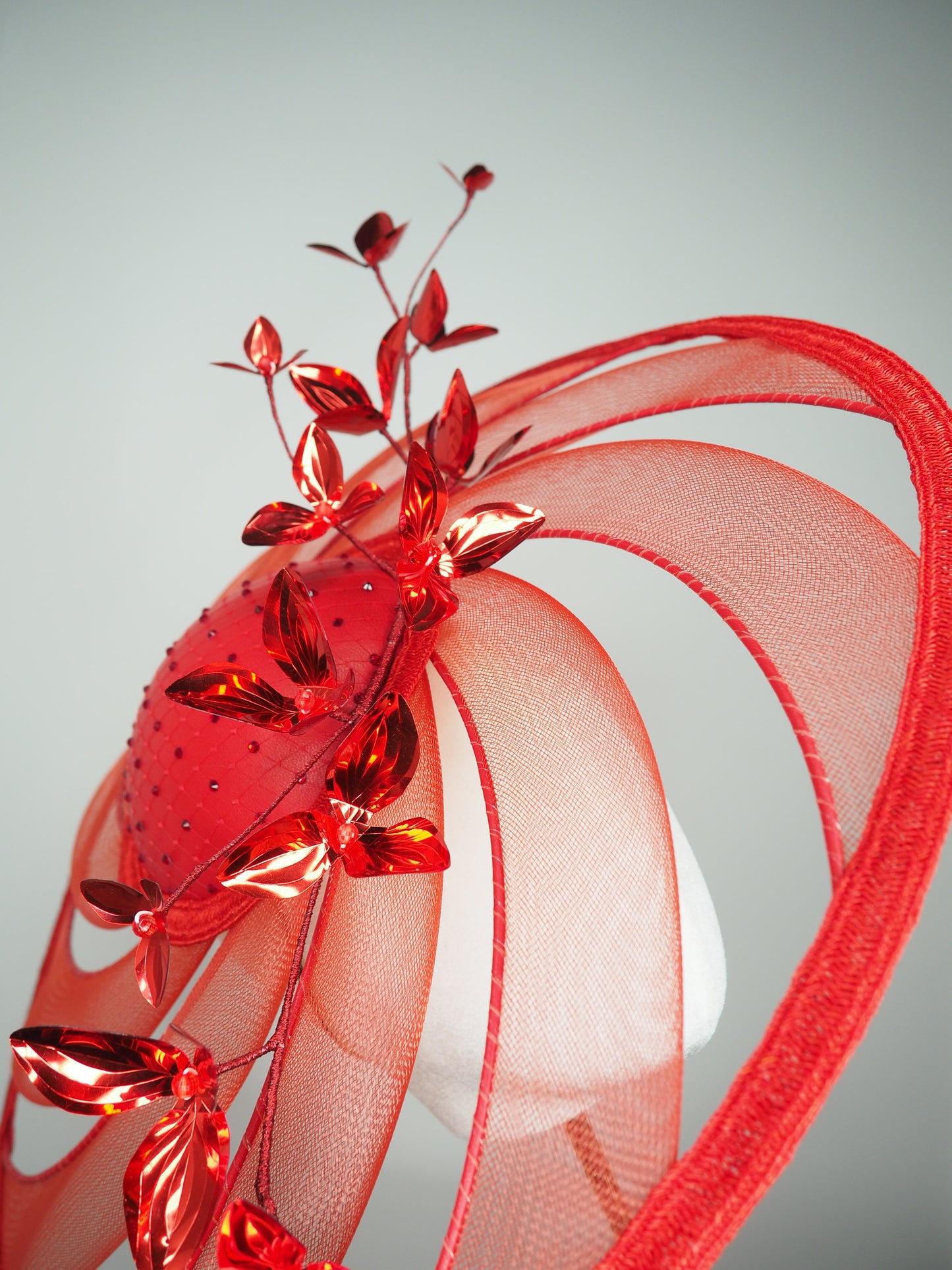 Scarlet Symphony - Wired crinoline swirl extra wide brim with leather base, diamante detail, and metallic red blossoms