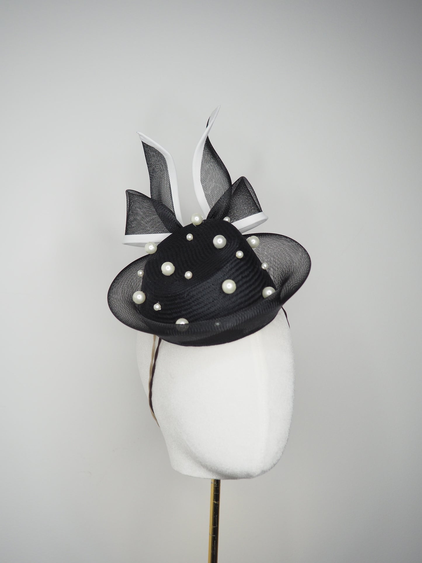 Back Tie pearl - Black asymmetric straw pillbox with wired crinoline bow in black and white and a scattering of pearls
