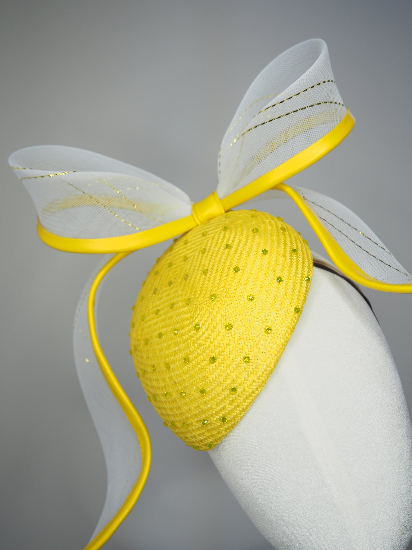 Sunshine - Yellow Petite Facehugger – yellow straw base covered in crystals, with white and gold crinoline bow edged in yellow leather