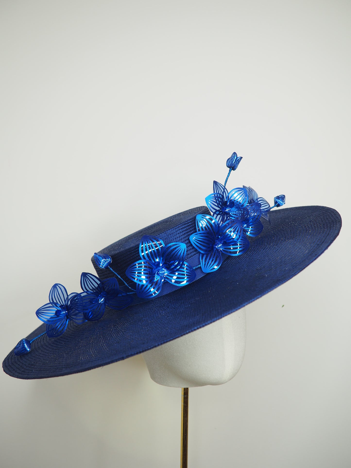 Deep blue - Deep blue straw boater with orchid vine in shades of blue crystoform.