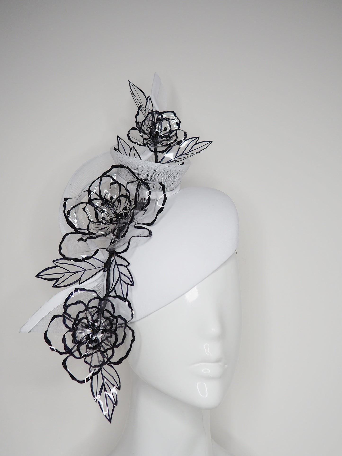 Translucent illusion - white leather face-hugger beret with crinoline swirl and flower detailing