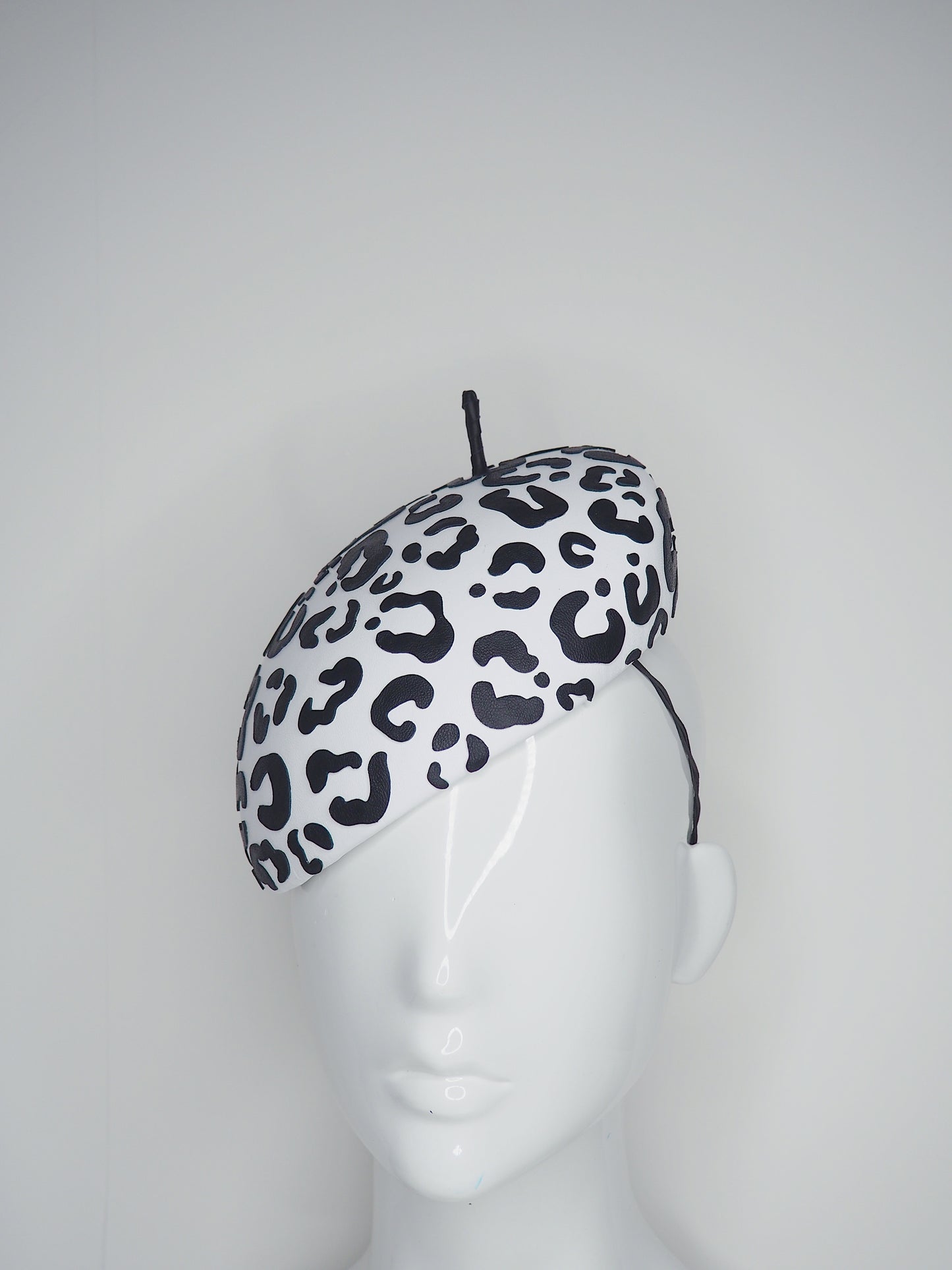 Lets Go Girls - Black Leather Leopard print cutouts on a white leather beret base