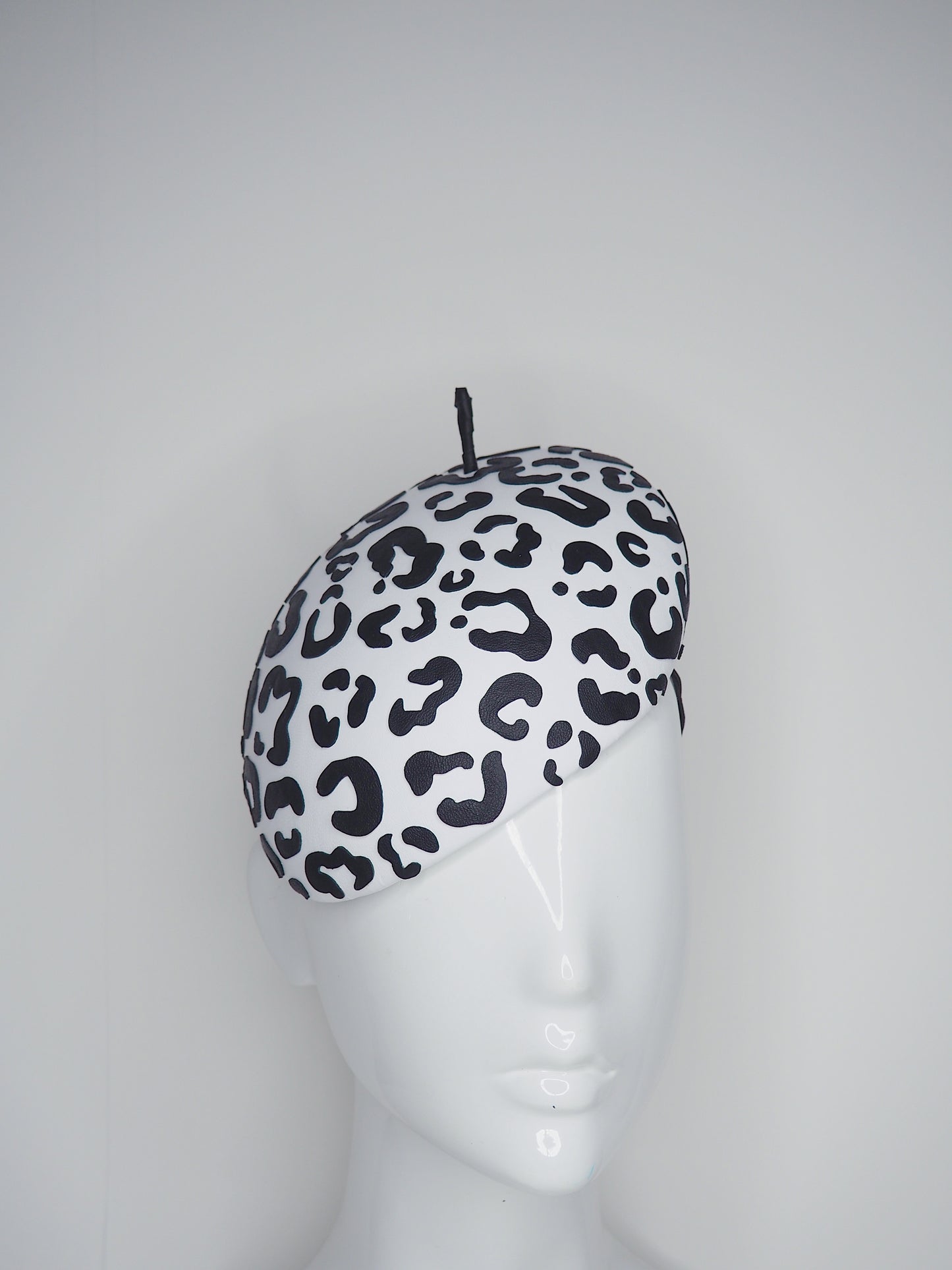 Lets Go Girls - Black Leather Leopard print cutouts on a white leather beret base