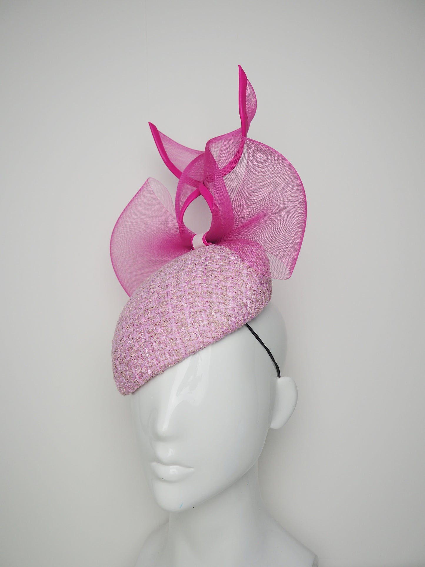 Bubblegum baby- Hot pink leather edged crinoline bow on a baby pink tweed face-hugger base.