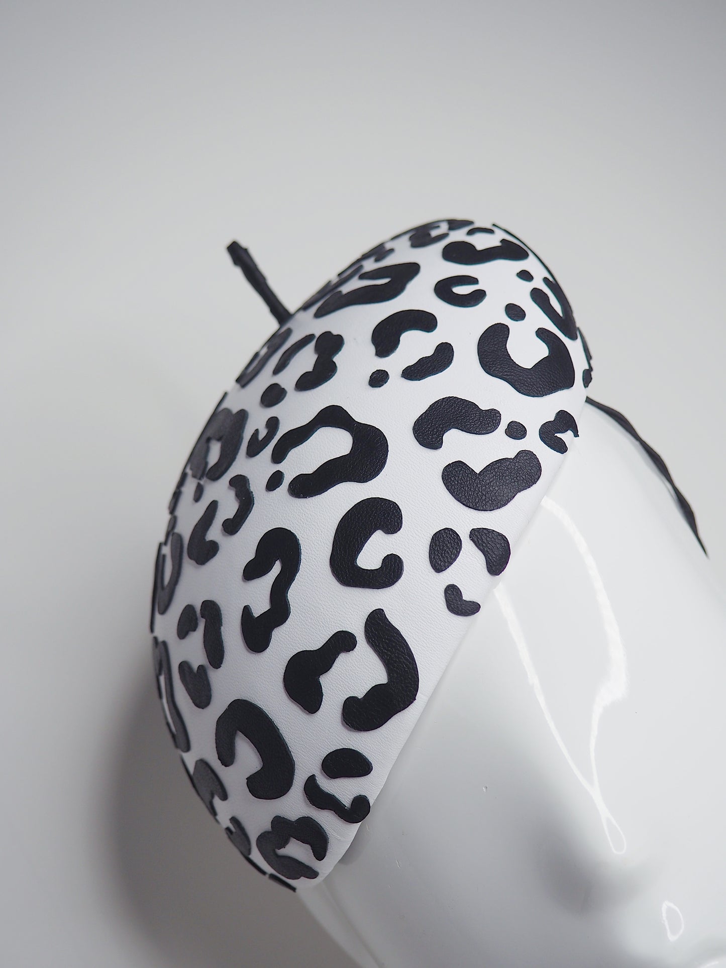Lets Go Girls - Black Leather Leopard print cutouts on a white leather beret base