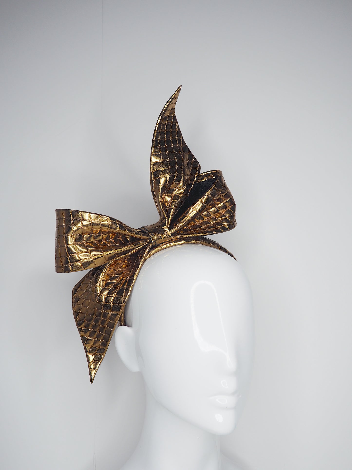 Bronze Bow - Bronze textured leather on a handmade leather headband.