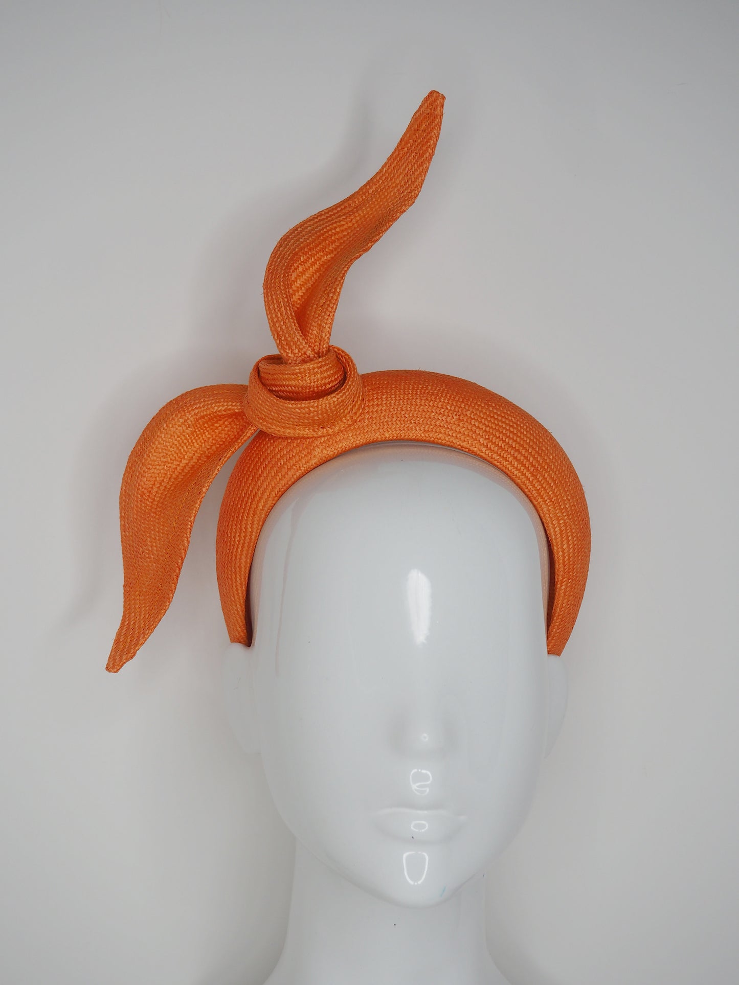 Tied in a Knot- Orange 3D blocked headband with a simple straw knot
