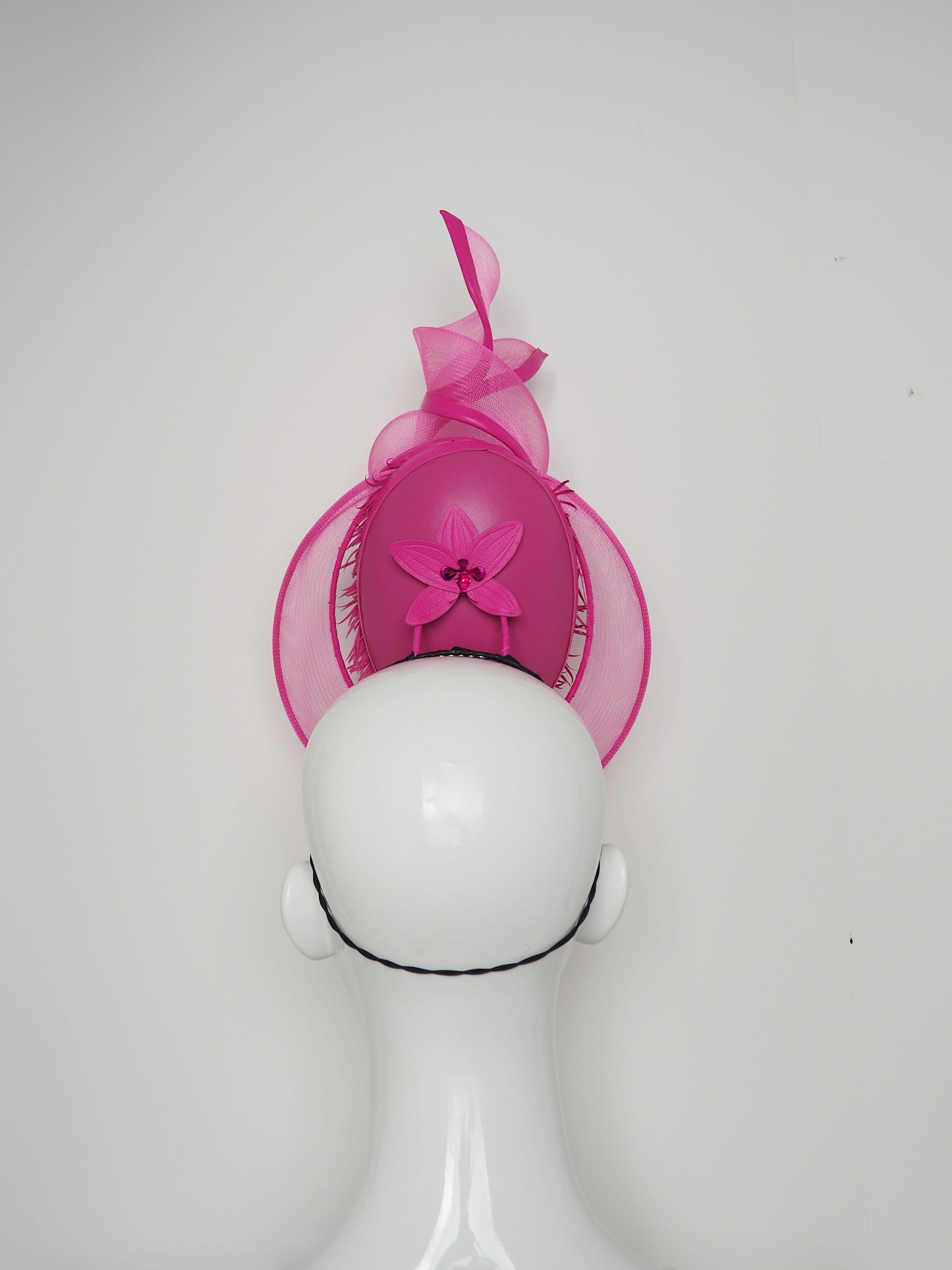 Tilt-a-whirl - Pink shredded patent leather percher with wired crinoline veil and swirl