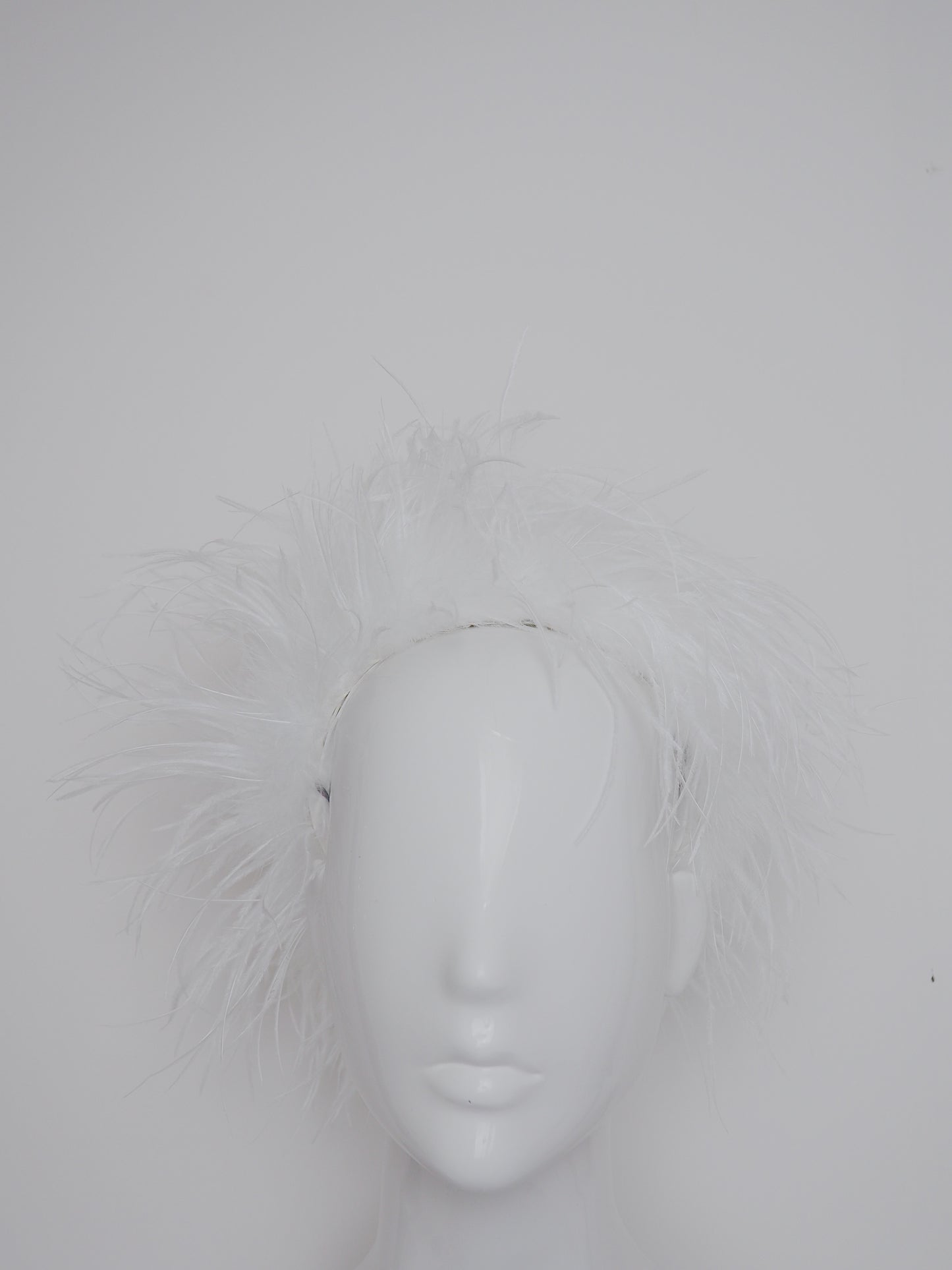 Winter Whisper - Ostrich covered Jackie O style pillbox with open top.