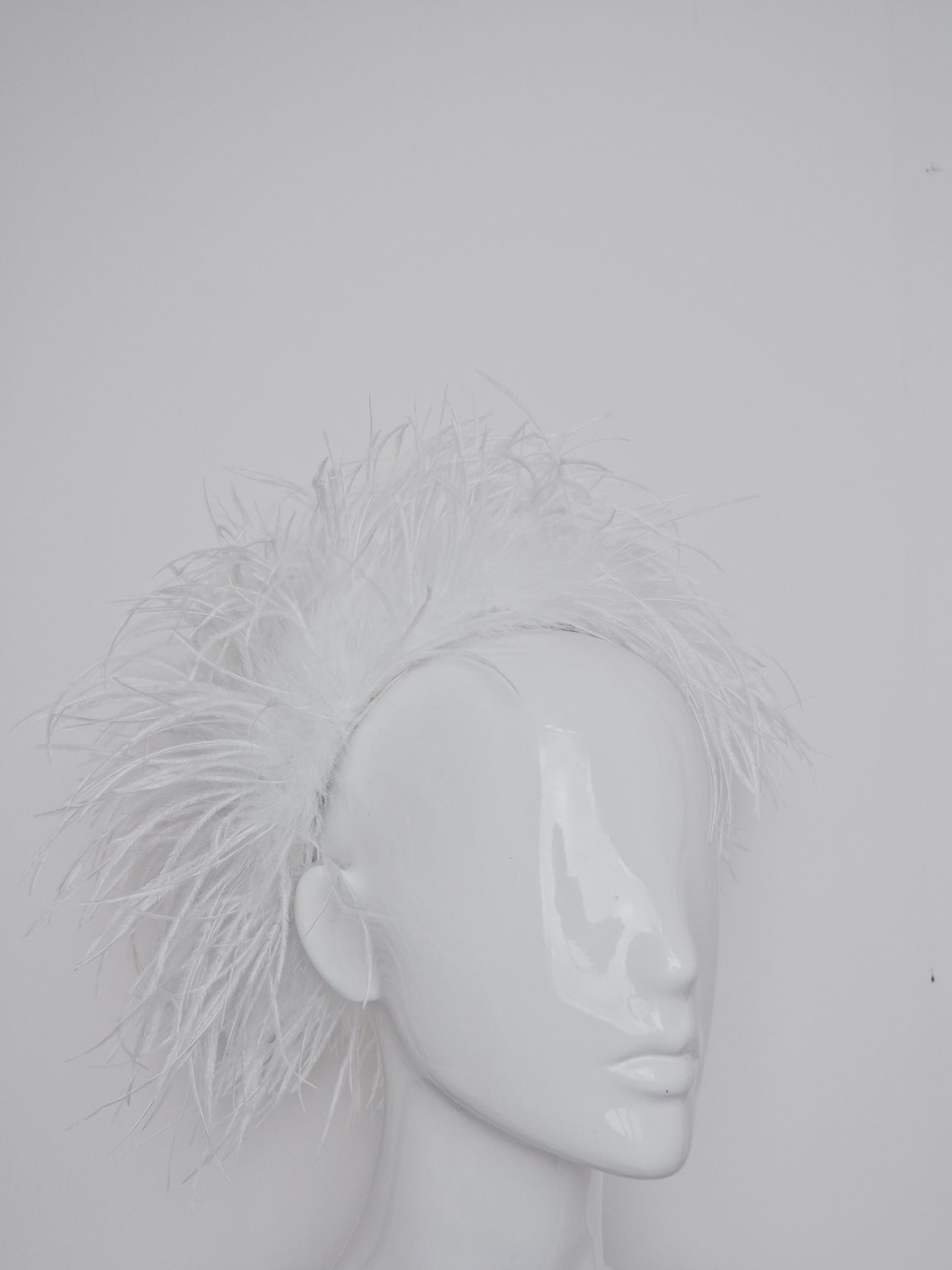 Winter Whisper - Ostrich covered Jackie O style pillbox with open top.