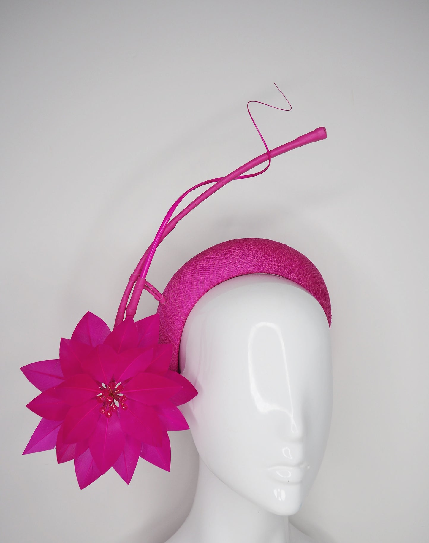 Flower burst - Hot Pink Tinalak straw base with sculpted quills and fleather starburst.