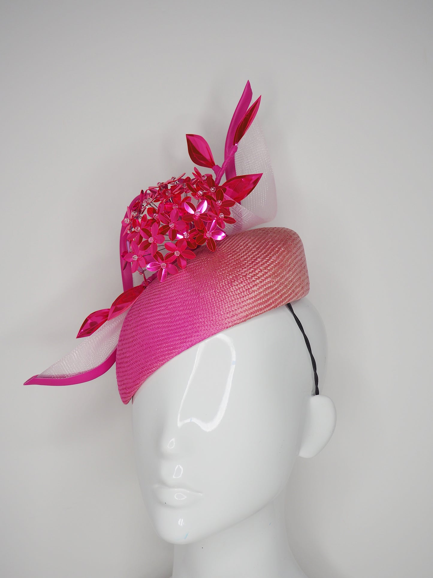 Disco barbie baby - hot pink Alium Flower ball on an ombre straw face hugger with a crinoline swirl headpiece.