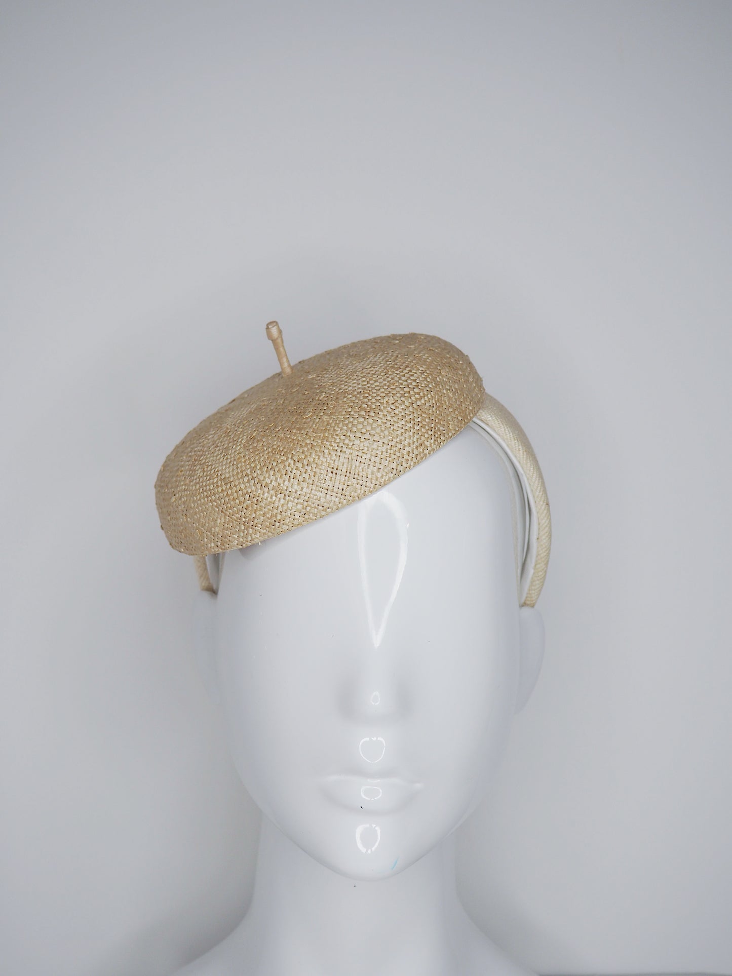Knotty But Nice - button beret on a Natural Straw headband.