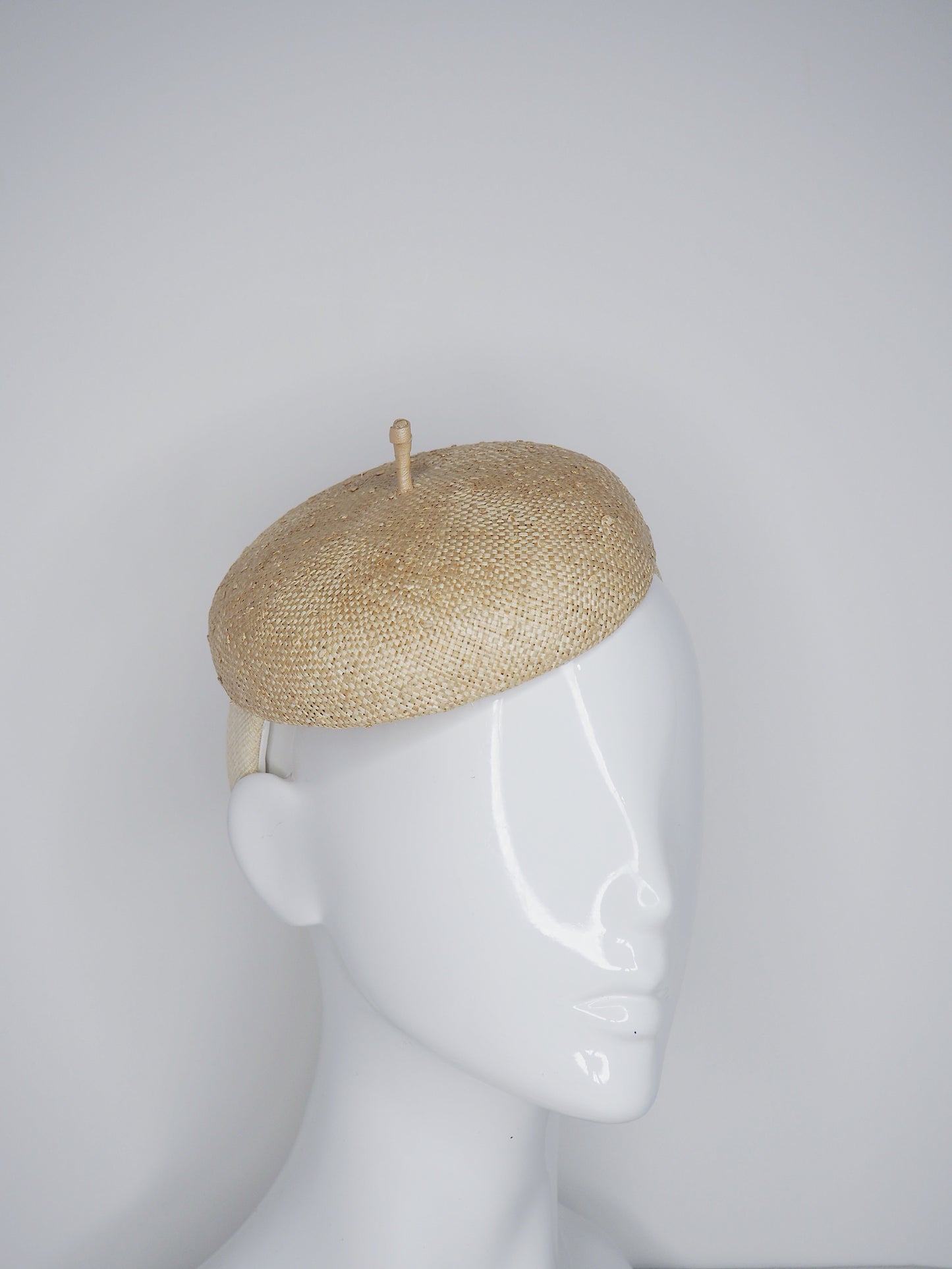 Knotty But Nice - button beret on a Natural Straw headband.