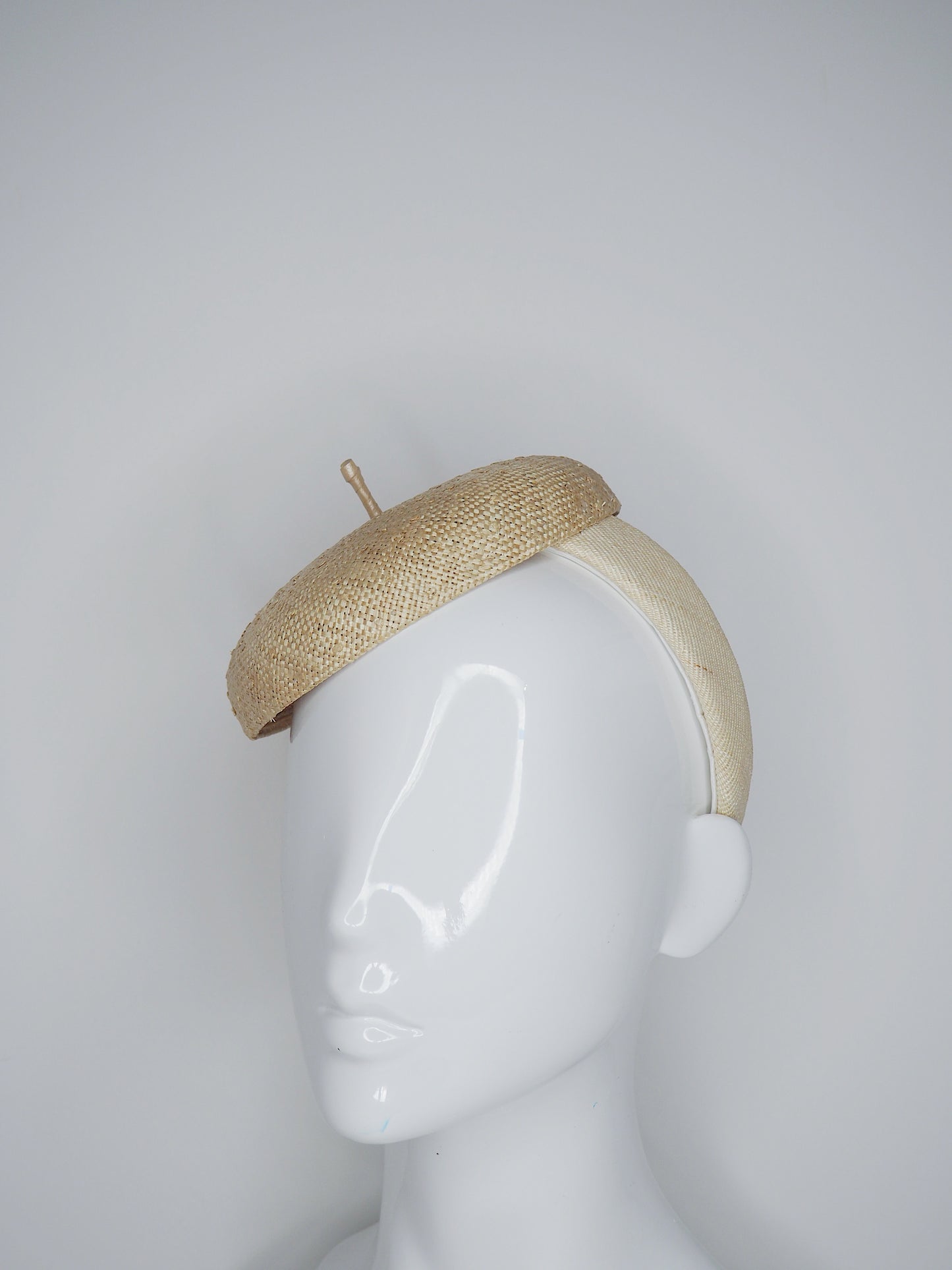 Knotty But Nice - button beret on a Natural Straw headband.