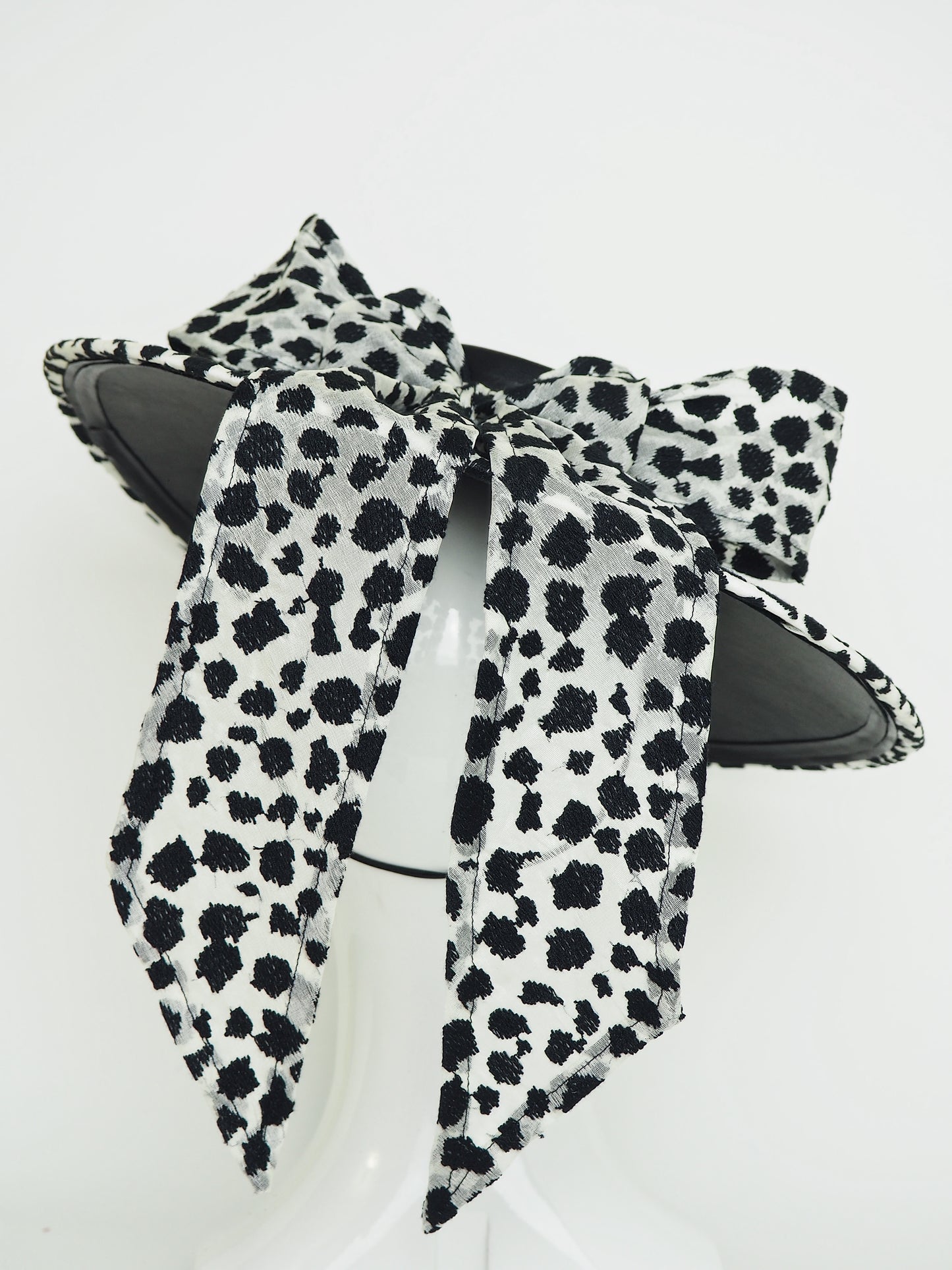 Stepping out - Medium shallow boater with black and off white bow detail