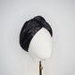 Glass Lake - A sculptural blocked turban crafted from luminous fabric inspired by morning reflections on water.