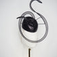 Black Swan - A sleek black lurex pillbox inspired by the graceful silhouette of a swan gliding across water.