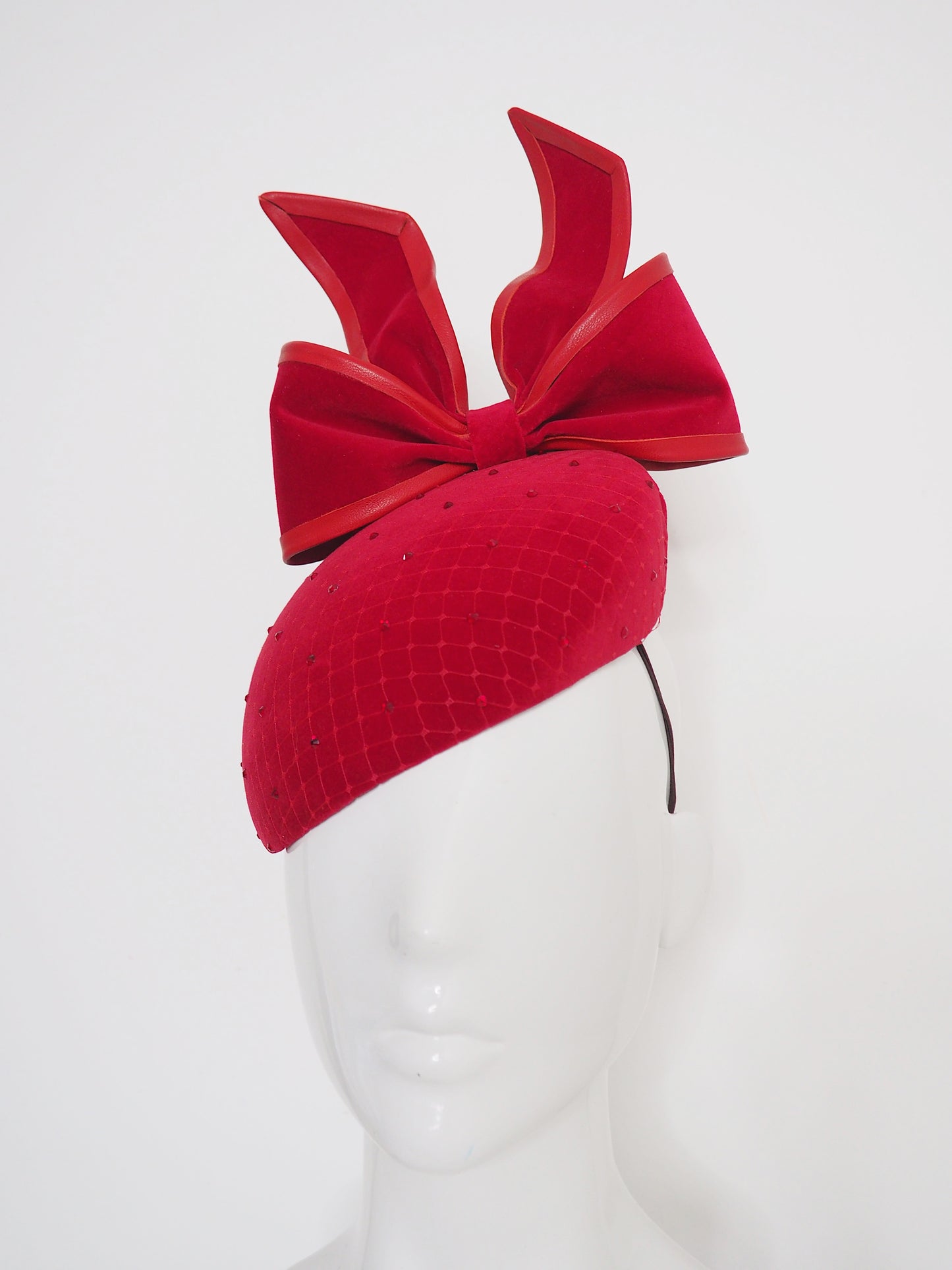 The Gift - Red wired upside down velvet bow with leather and crystal details.