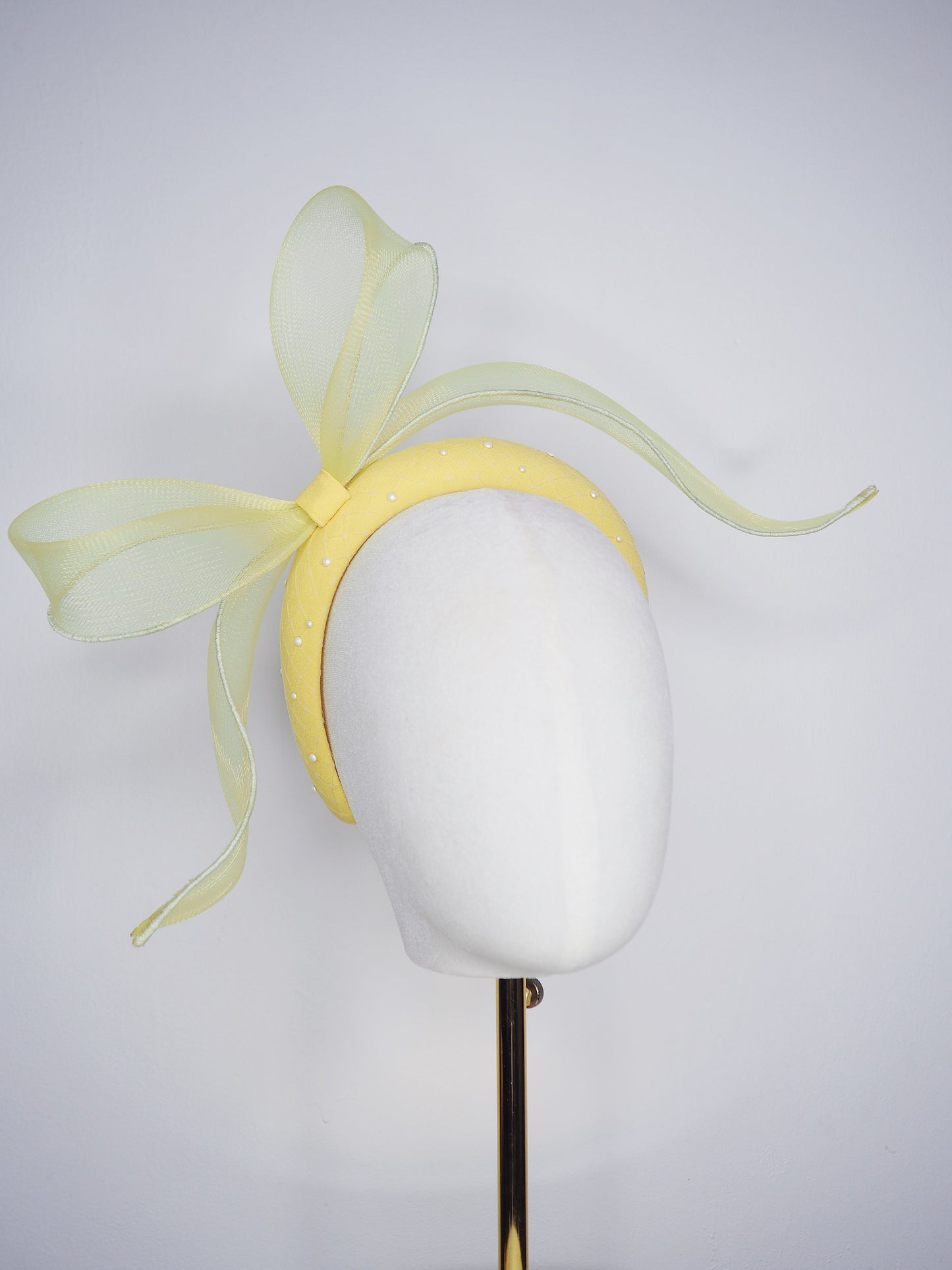 Soleil - A joyful lemon bow headpiece with pearl encrusted veil detail