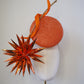 Solar Spark - Round gold and orange percher with orange sequin film starburst and gold quill detail