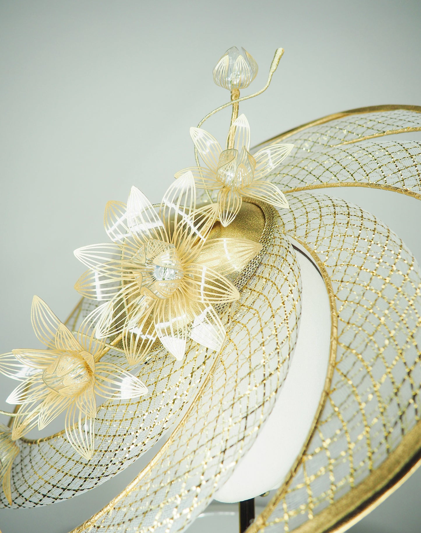 Ray of light - Wired crinoline brim with metallic swirl and pale gold crystoform Lillies.