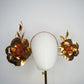 Sunlit Bloom - A wraparound floral headpiece featuring oversized golden blooms with vibrant orange centres.