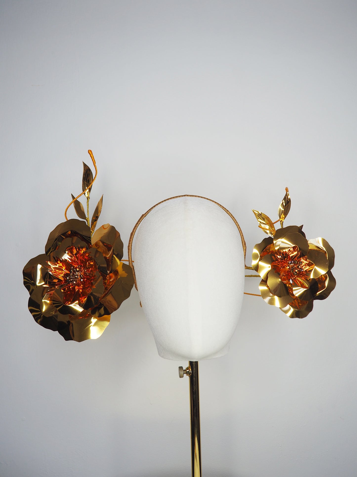 Sunlit Bloom - A wraparound floral headpiece featuring oversized golden blooms with vibrant orange centres.